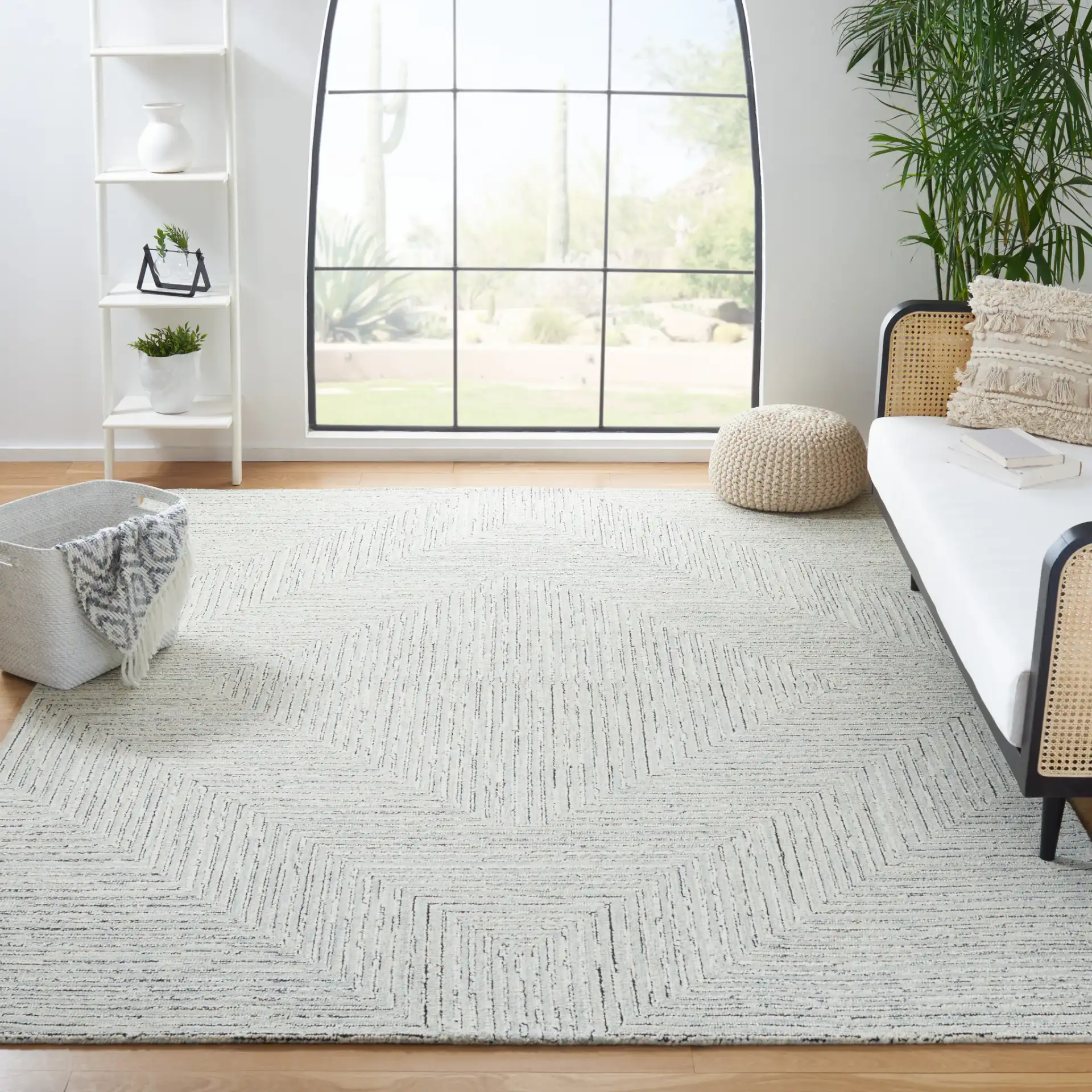 Micro-Loop Concentric Maze Hand-Tufted Wool Rug in Light Gray / Ivory in a styled room