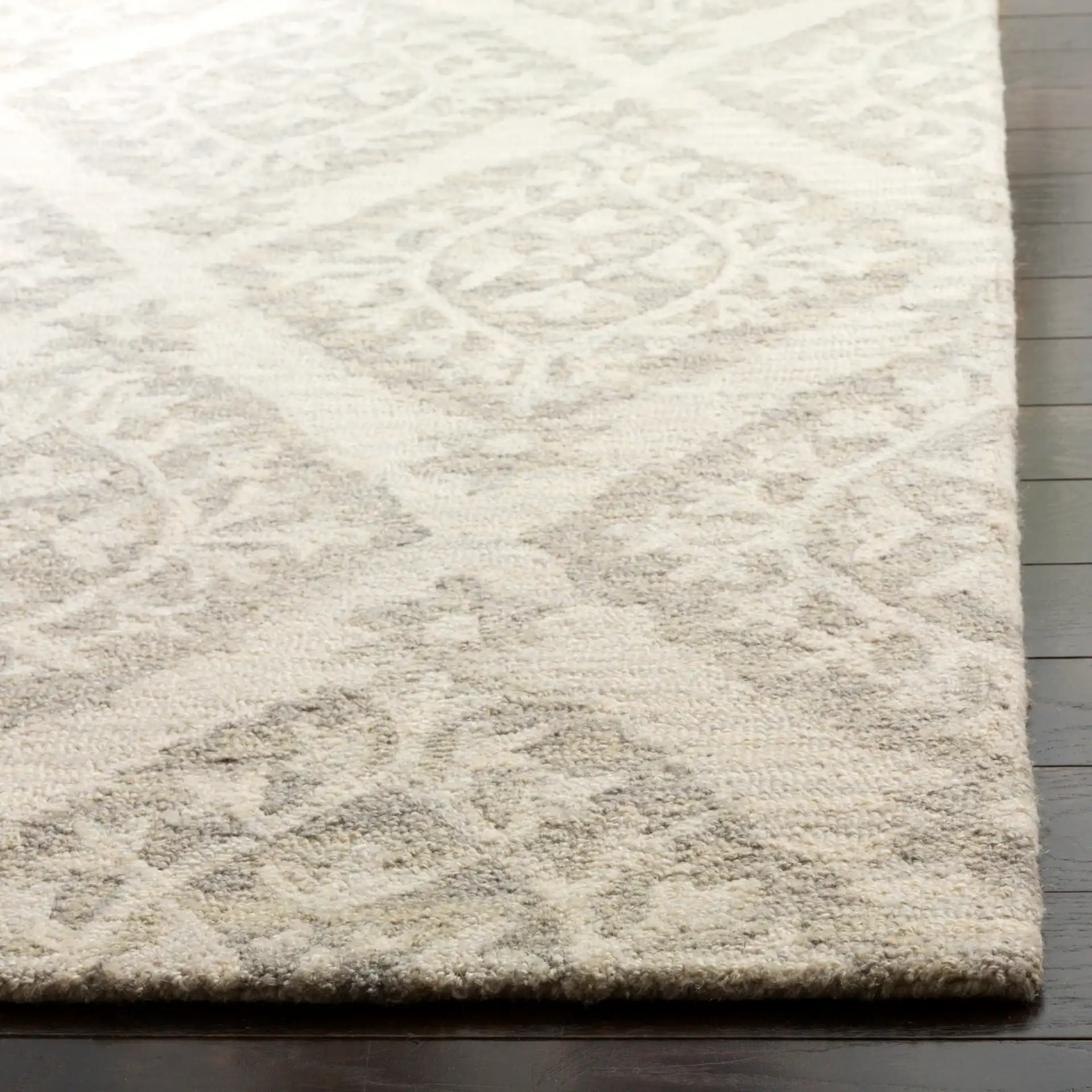 Micro-Loop Diamond Medallion Hand-Tufted Wool Rug in Light Gray in a styled room