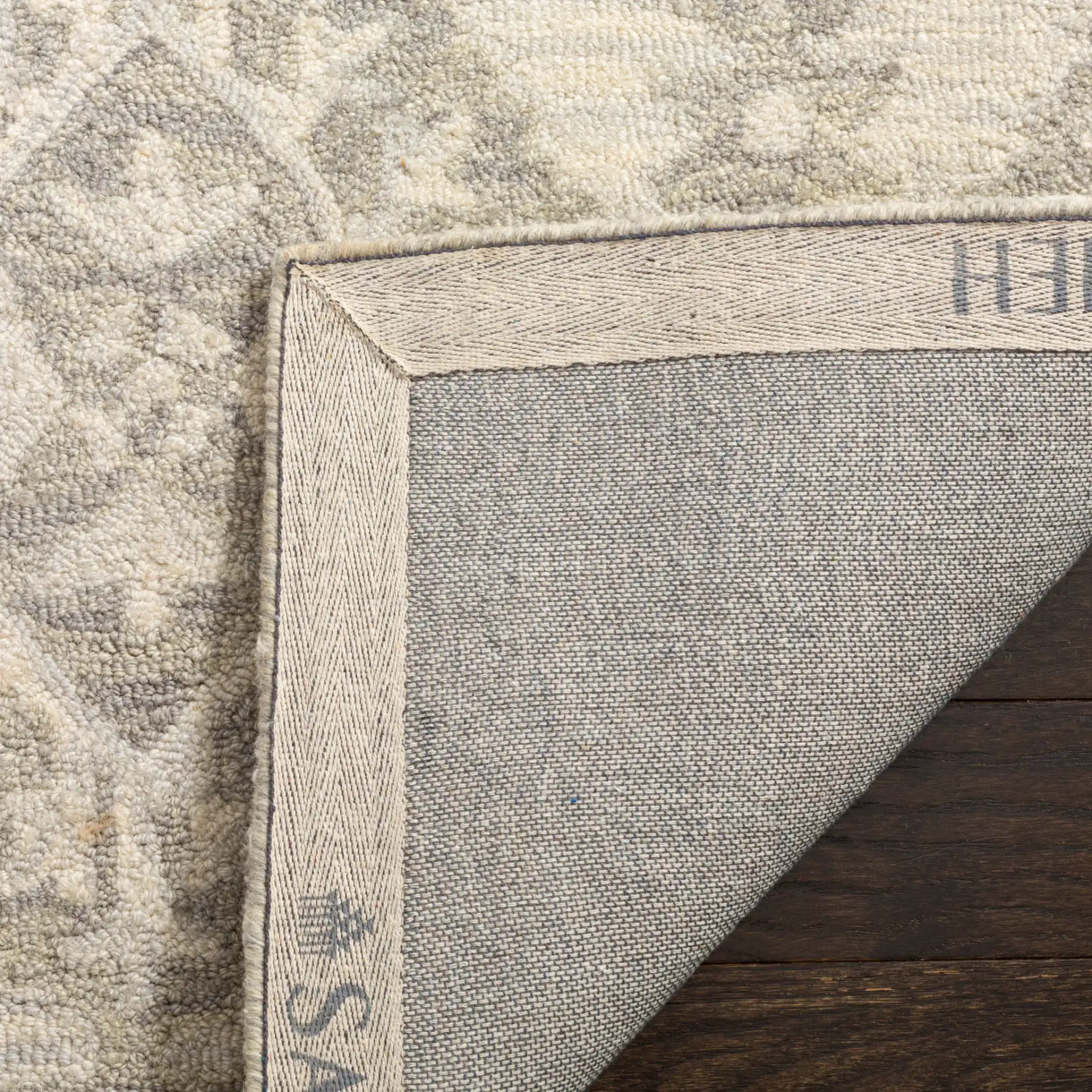 Micro-Loop Diamond Medallion Hand-Tufted Wool Rug in Light Gray in a styled room