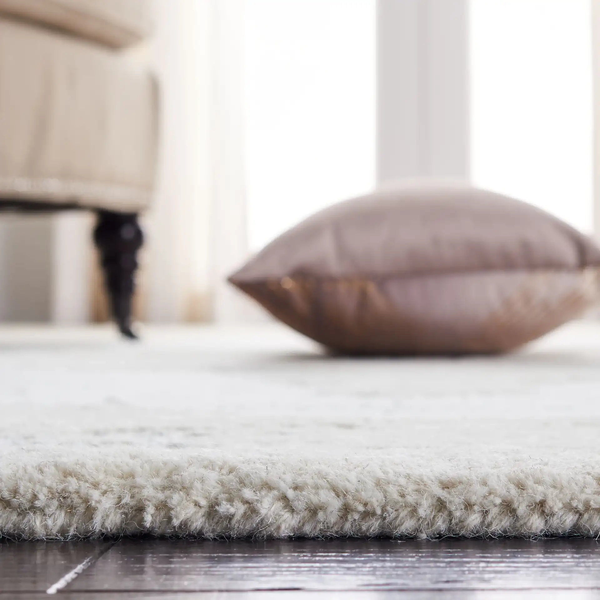 Micro-Loop Medallion Hand-Tufted Wool Rug in Ivory / Gray in a styled room