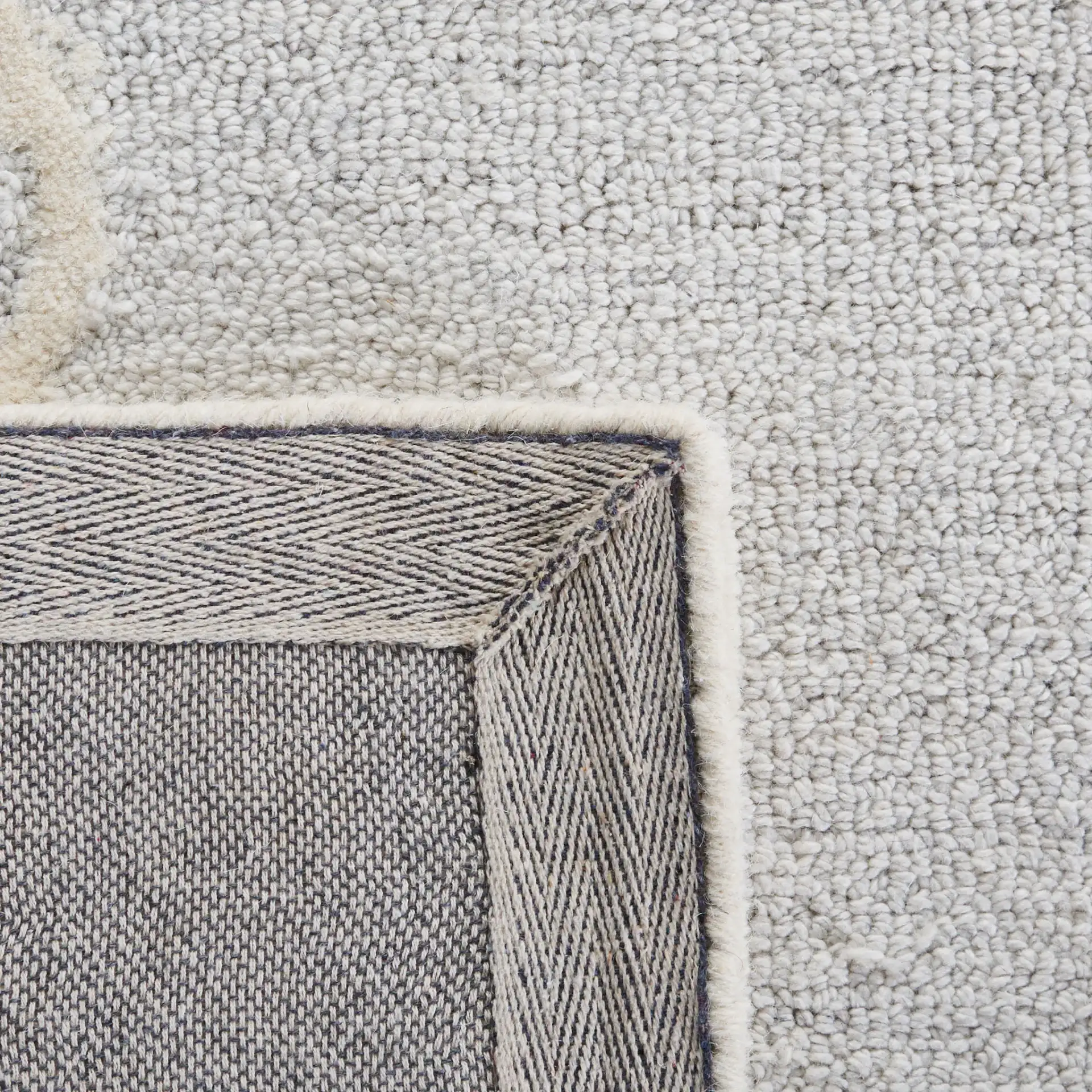 Micro-Loop Medallion Hand-Tufted Wool Rug in Ivory / Gray in a styled room