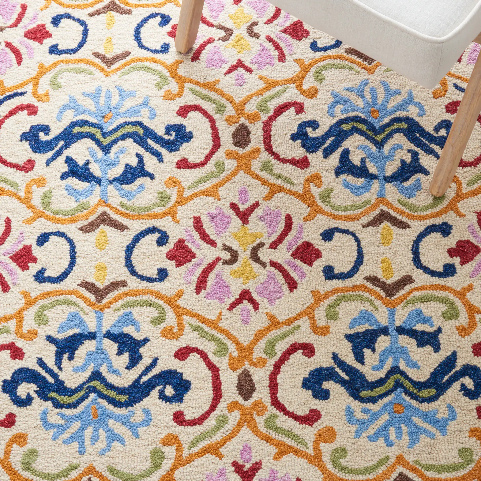 Micro-Loop Scrolling Floral Hand-Tufted Wool Rug in Beige / Blue in a styled room