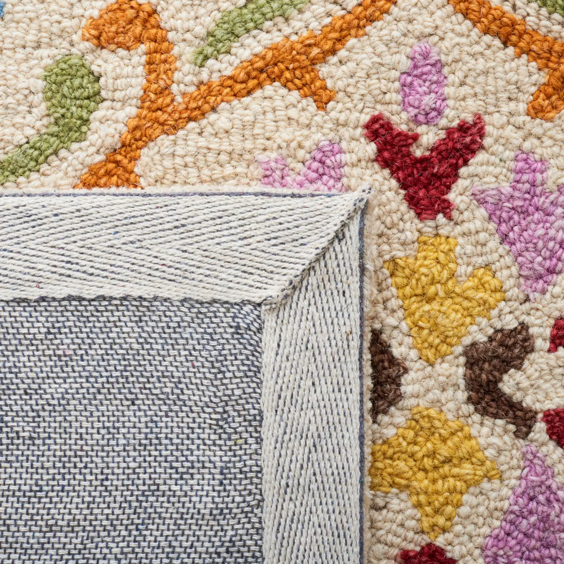 Micro-Loop Scrolling Floral Hand-Tufted Wool Rug in Beige / Blue in a styled room