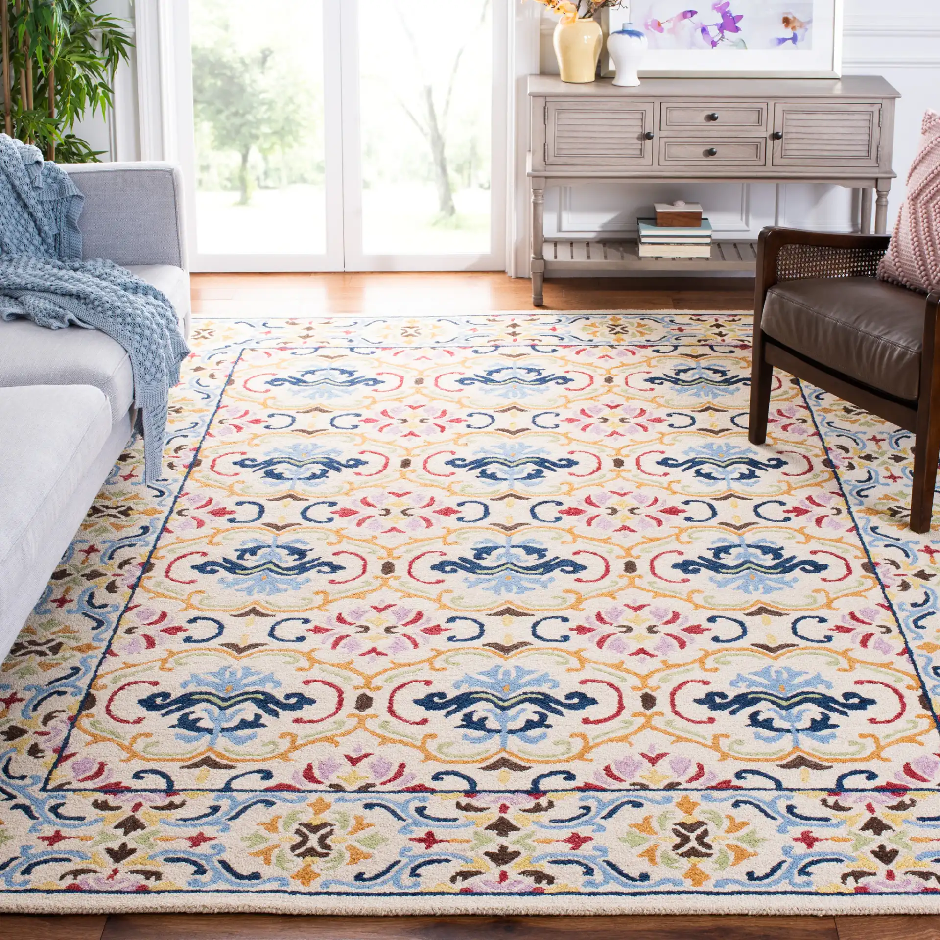 Micro-Loop Scrolling Floral Hand-Tufted Wool Rug in Beige / Blue in a styled room