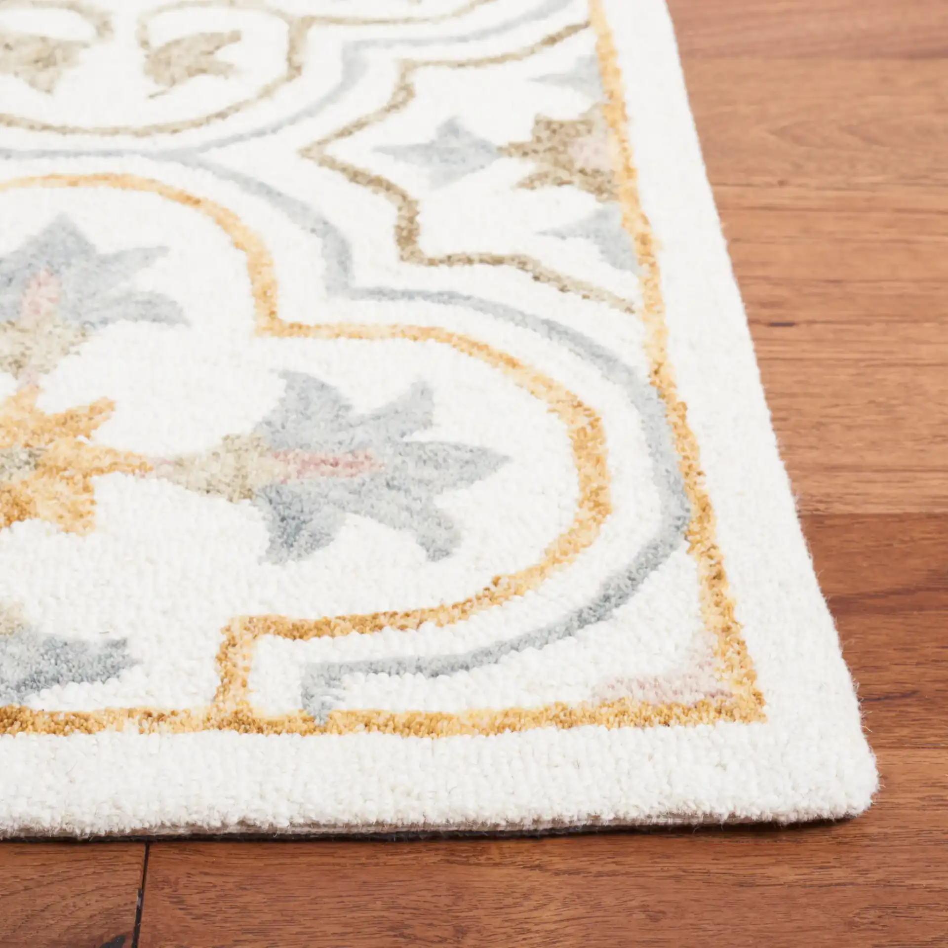 Micro-Loop Star Tile Hand-Tufted Wool Rug in Ivory / Gray in a styled room