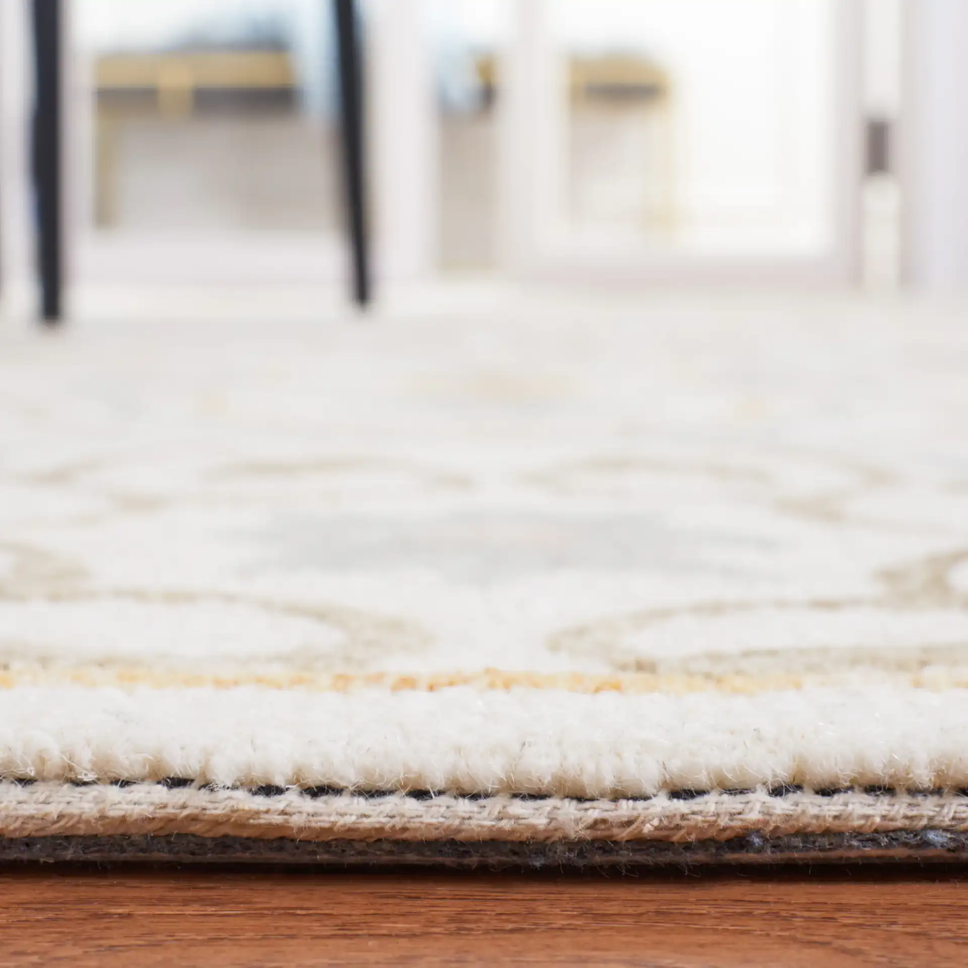 Micro-Loop Star Tile Hand-Tufted Wool Rug in Ivory / Gray in a styled room