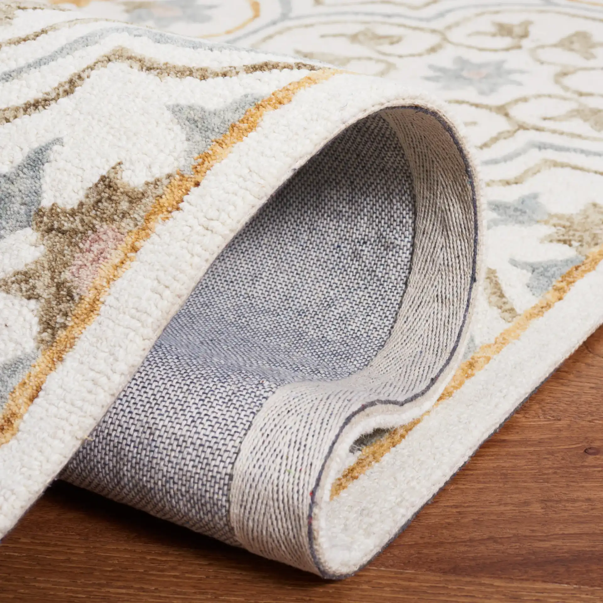 Micro-Loop Star Tile Hand-Tufted Wool Rug in Ivory / Gray in a styled room
