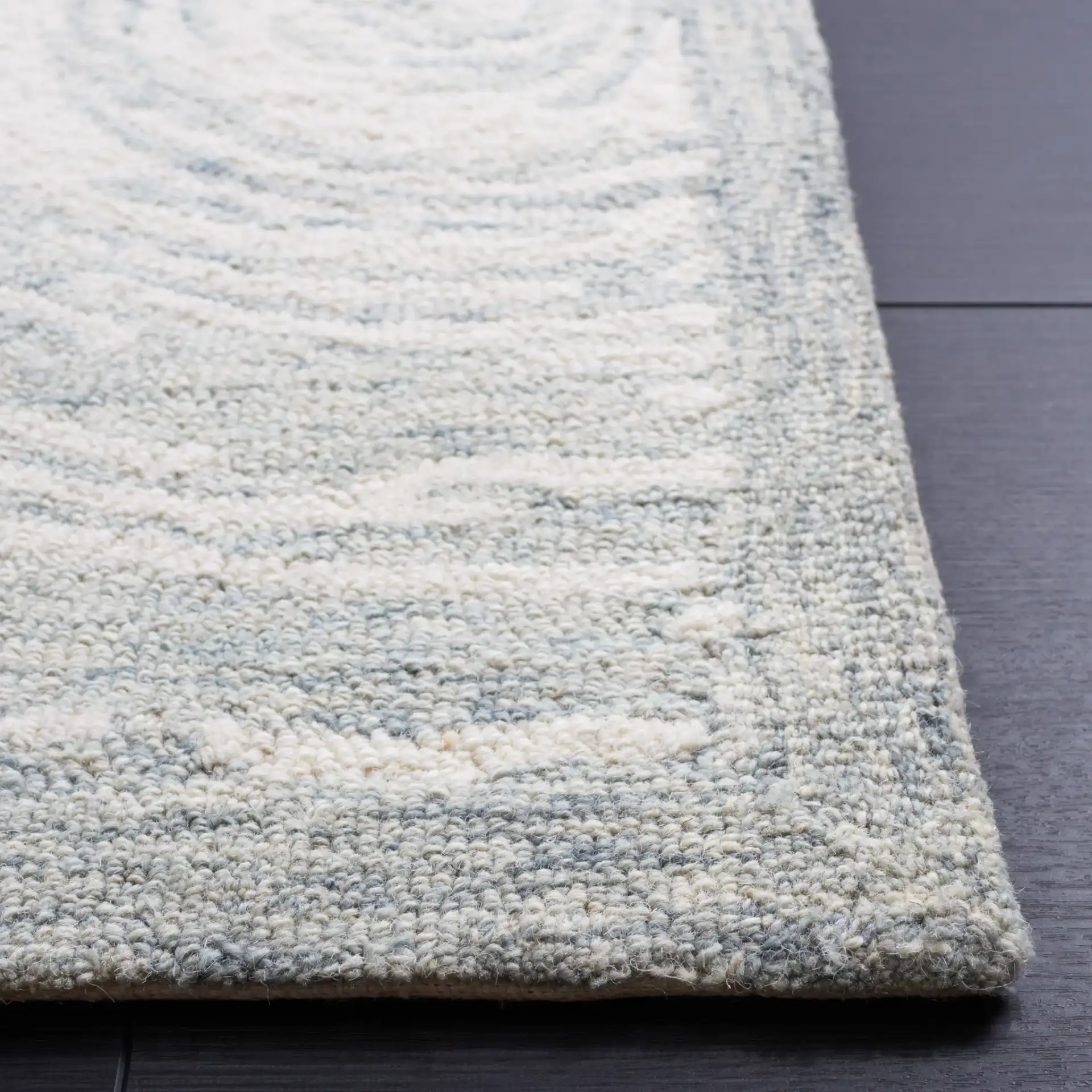 Micro-Loop Swirling Circles Hand-Tufted Wool Rug in Gray / Ivory in a styled room