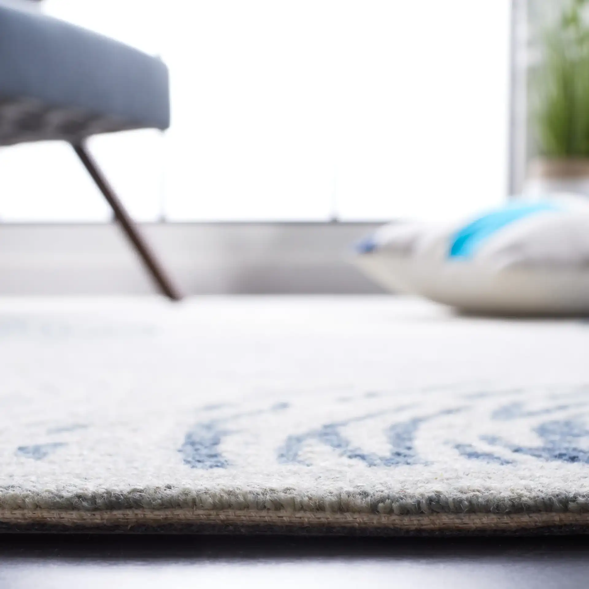 Micro-Loop Swirling Circles Hand-Tufted Wool Rug in Gray / Ivory in a styled room