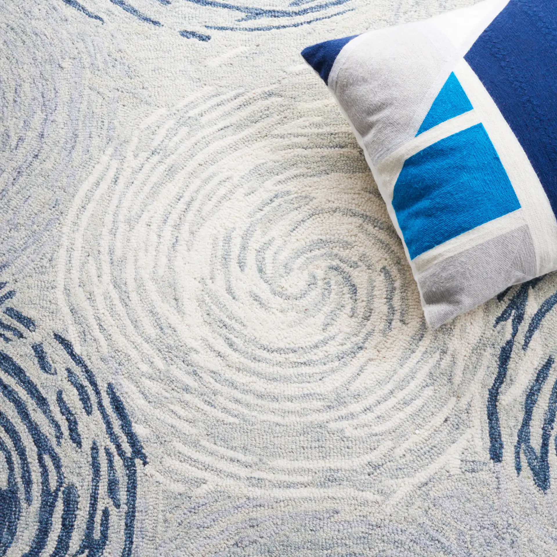 Micro-Loop Swirling Circles Hand-Tufted Wool Rug in Gray / Ivory in a styled room