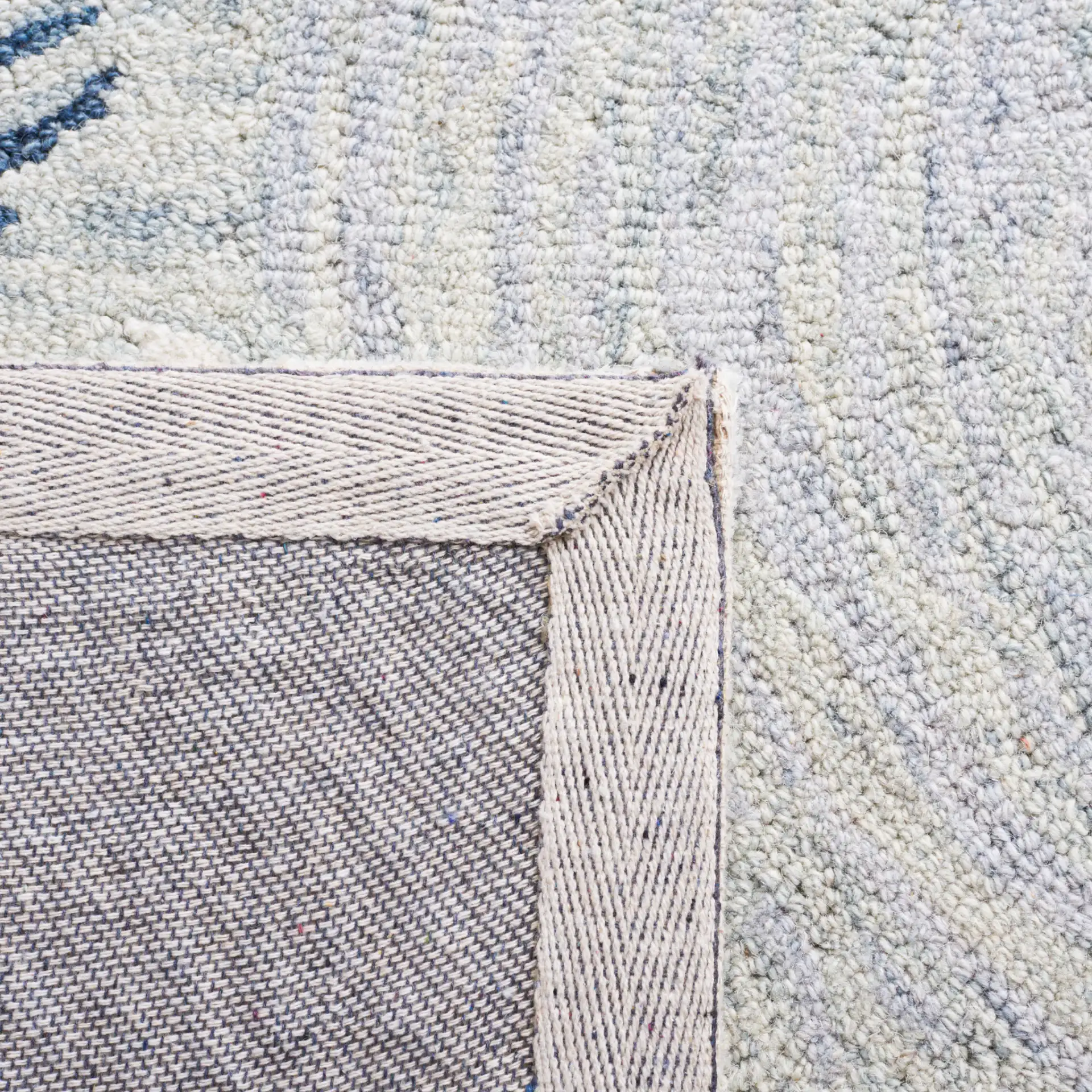 Micro-Loop Swirling Circles Hand-Tufted Wool Rug in Gray / Ivory in a styled room