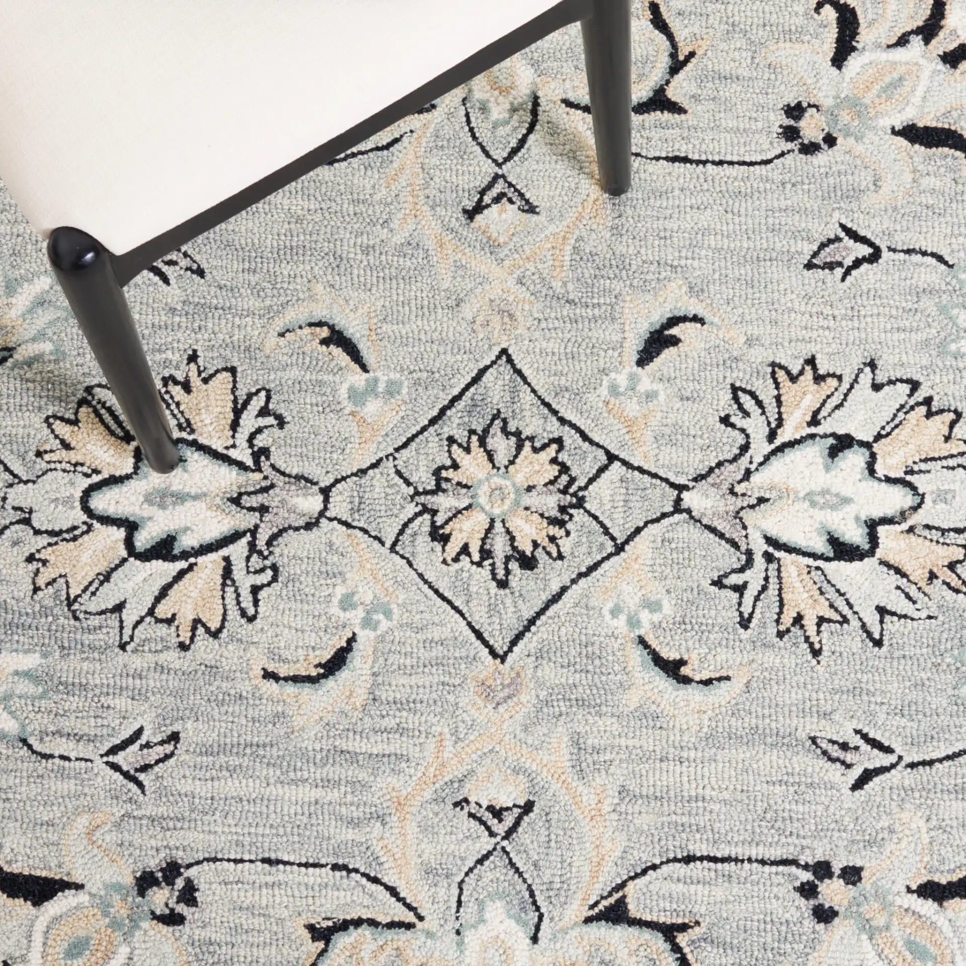 Micro-Loop Palmette Border Hand-Tufted Wool Rug in Gray / Ivory in a styled room