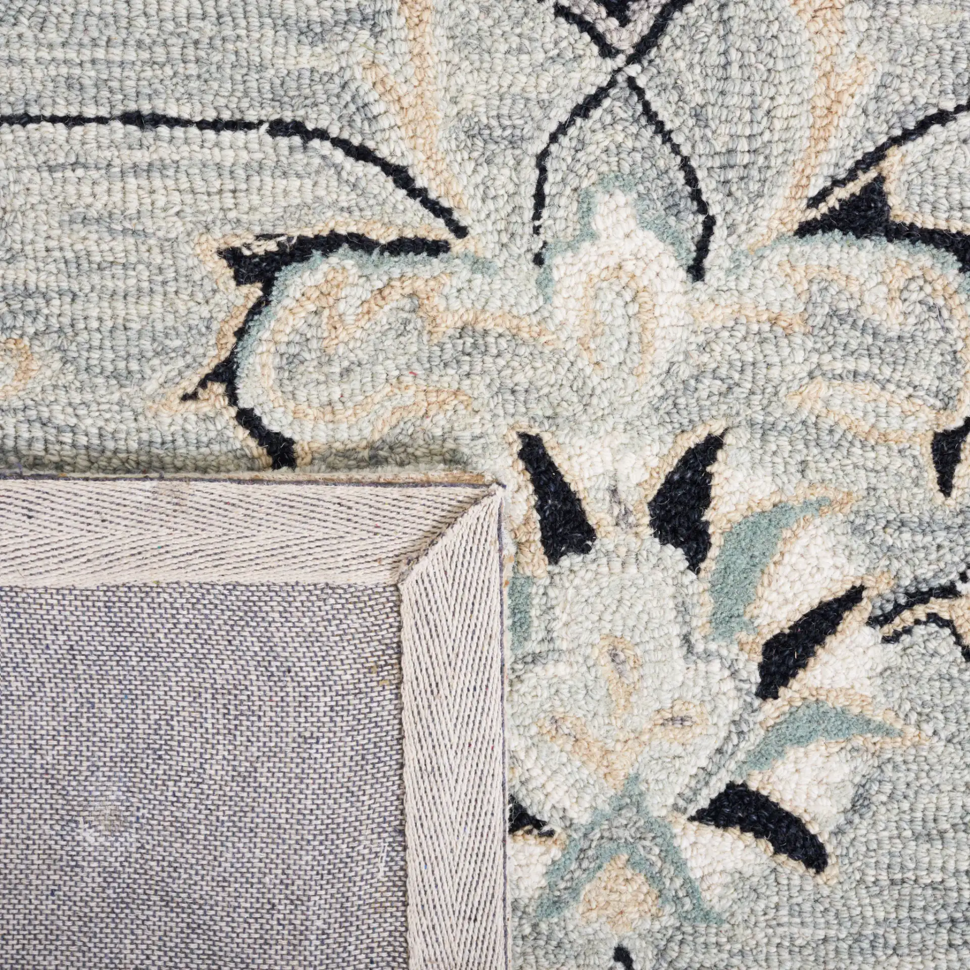 Micro-Loop Palmette Border Hand-Tufted Wool Rug in Gray / Ivory in a styled room