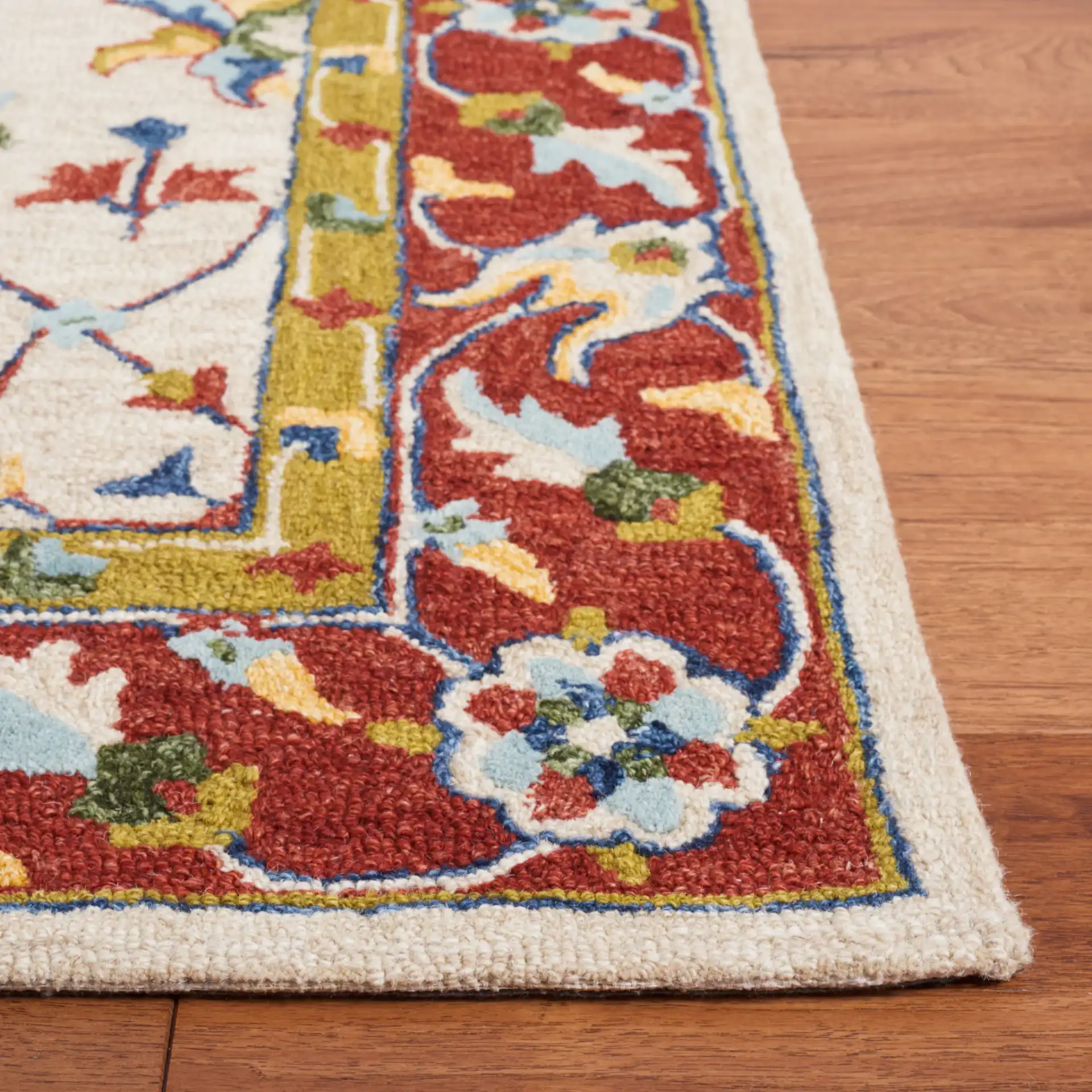 Micro-Loop Bordered Floral Trellis Hand-Tufted Wool Rug in Beige / Rust in a styled room