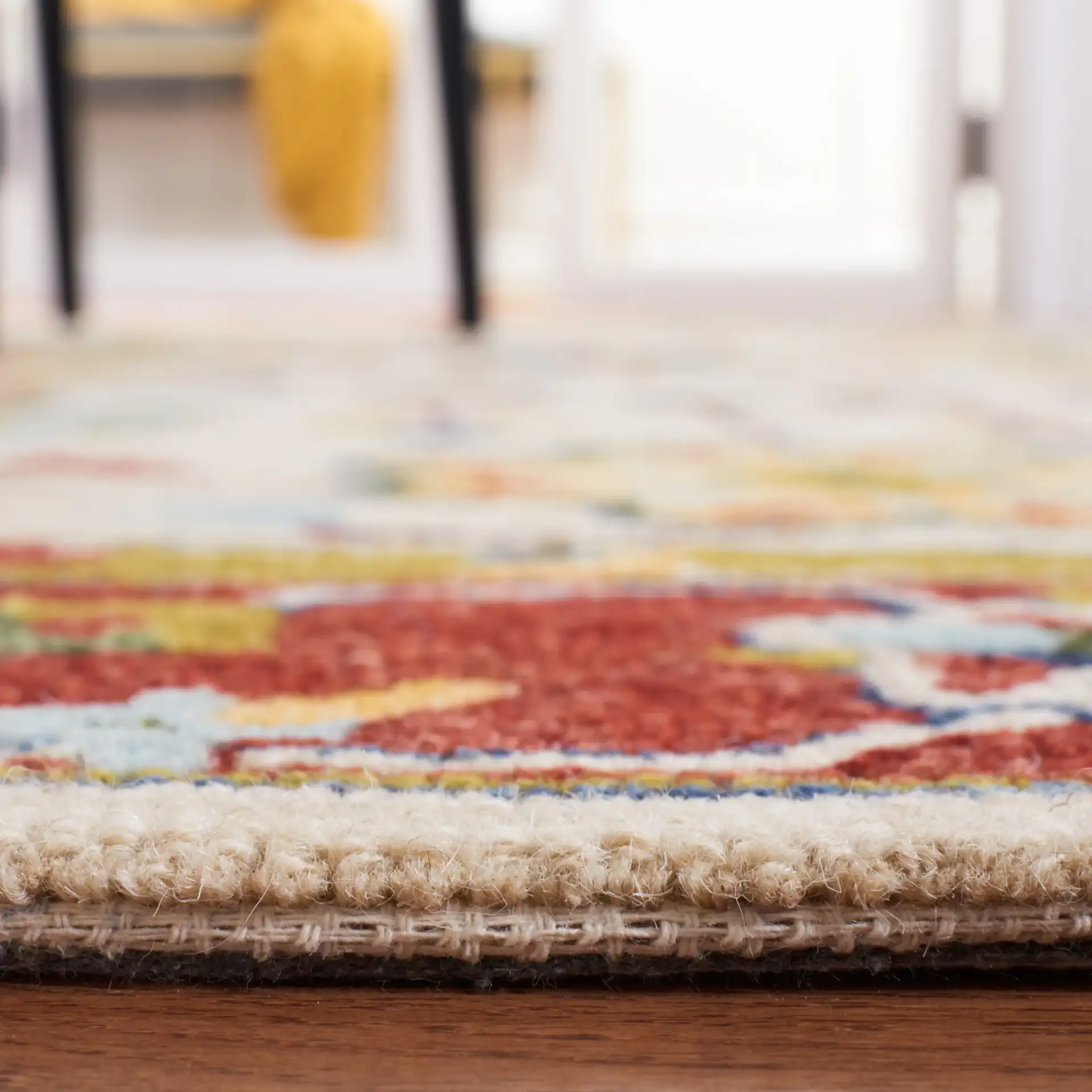 Micro-Loop Bordered Floral Trellis Hand-Tufted Wool Rug in Beige / Rust in a styled room