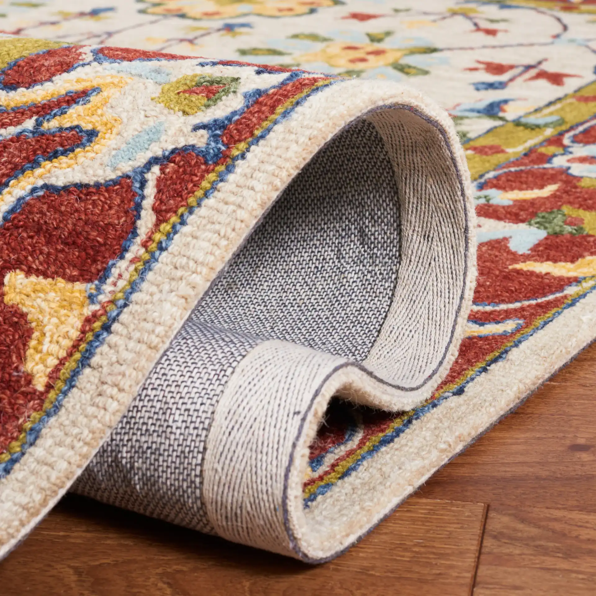 Micro-Loop Bordered Floral Trellis Hand-Tufted Wool Rug in Beige / Rust in a styled room