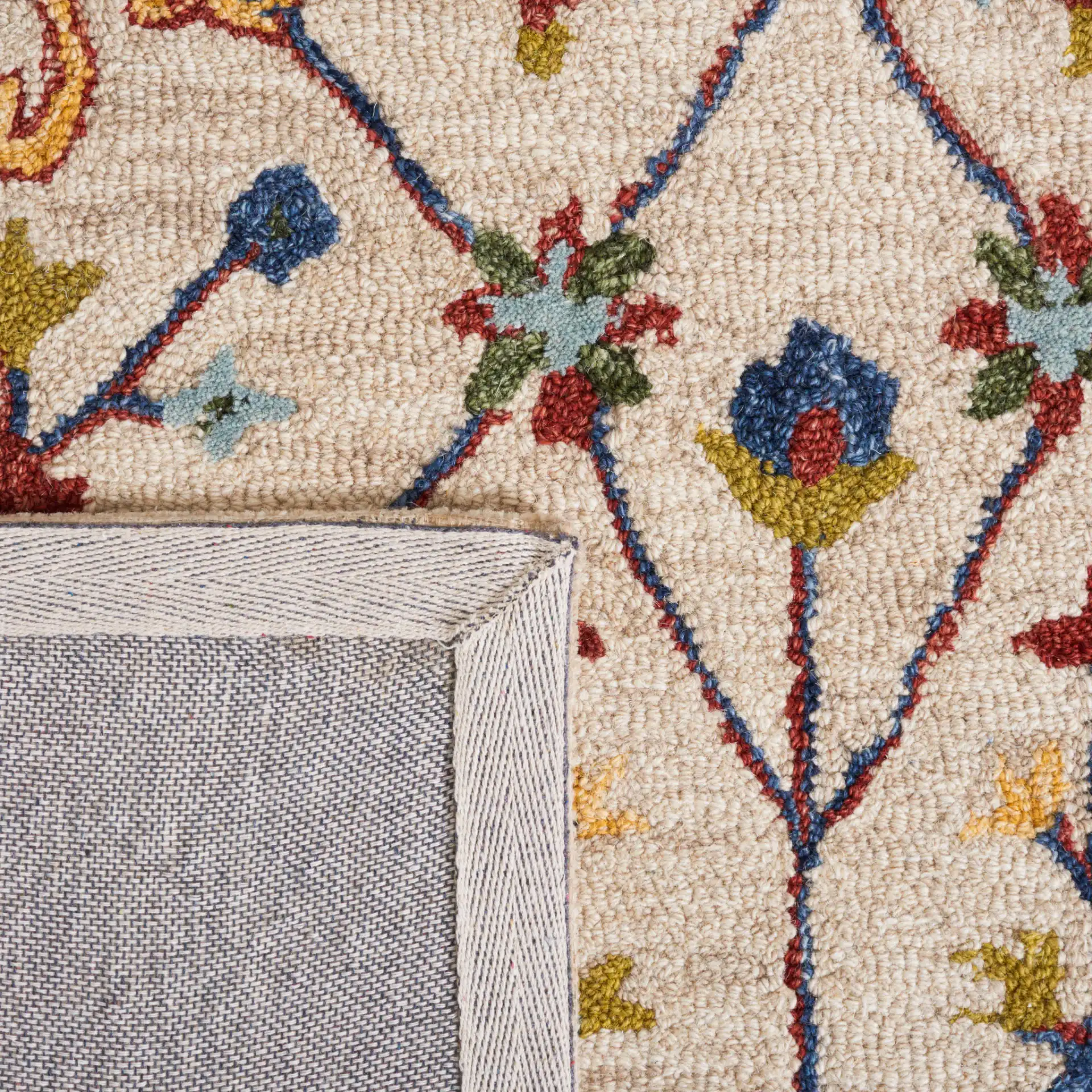Micro-Loop Bordered Floral Trellis Hand-Tufted Wool Rug in Beige / Rust in a styled room