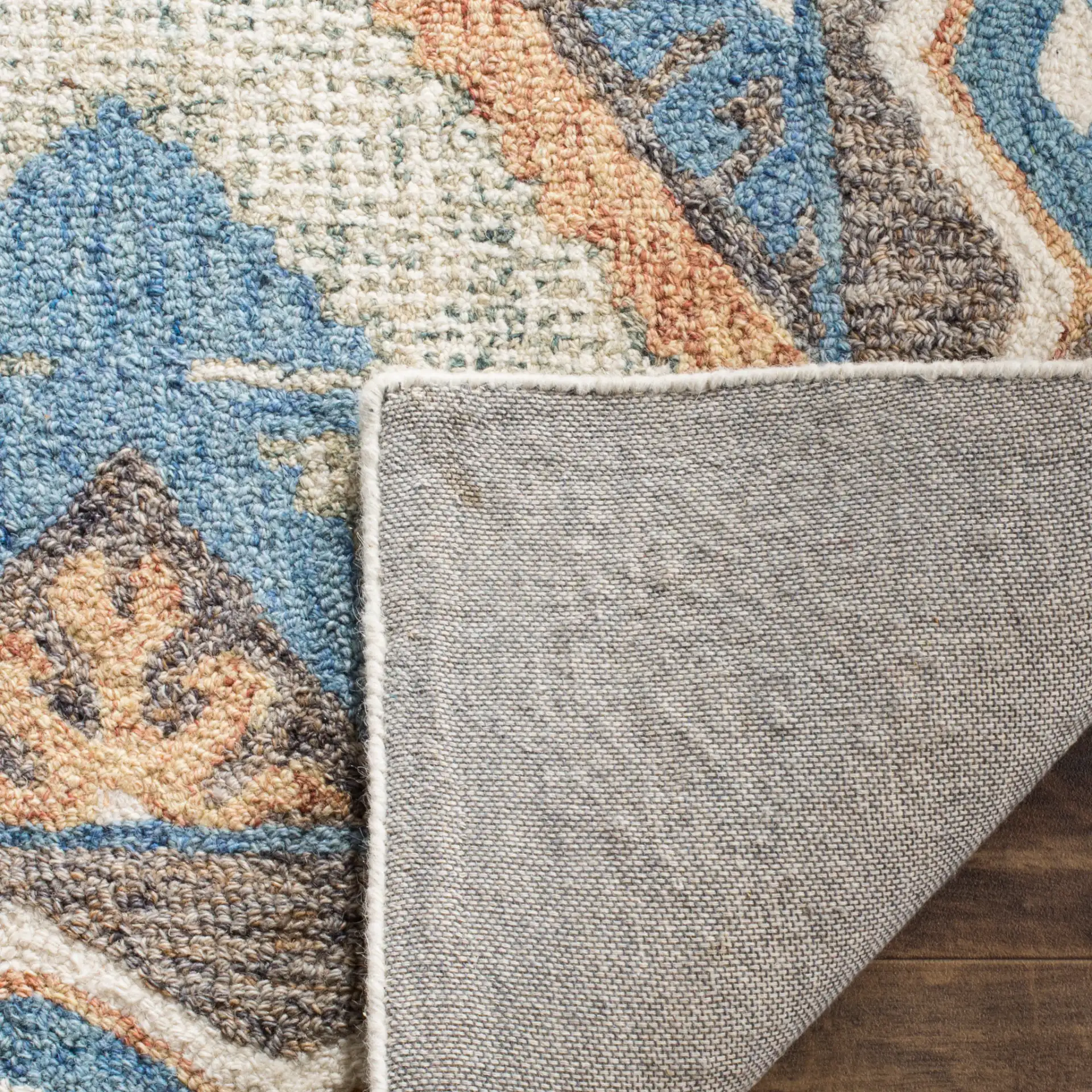 Micro-Loop Micro Loop Southwestern Diamond Hand-Tufted Wool Rug in Blue / Beige in a styled room