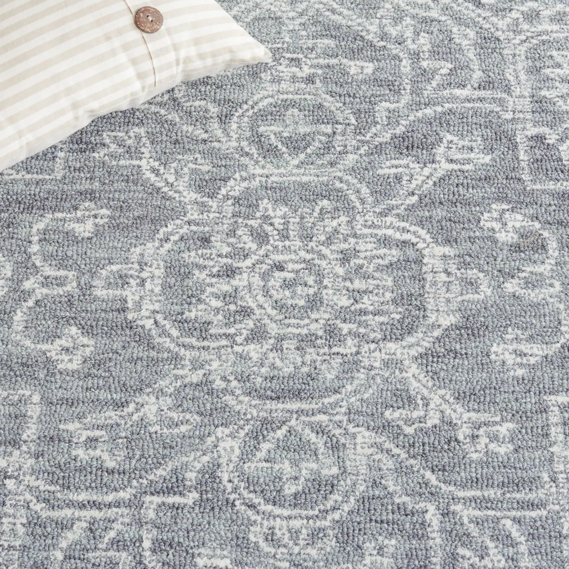 Micro-Loop Medallion Wool Rug in Gray / Ivory in a styled room