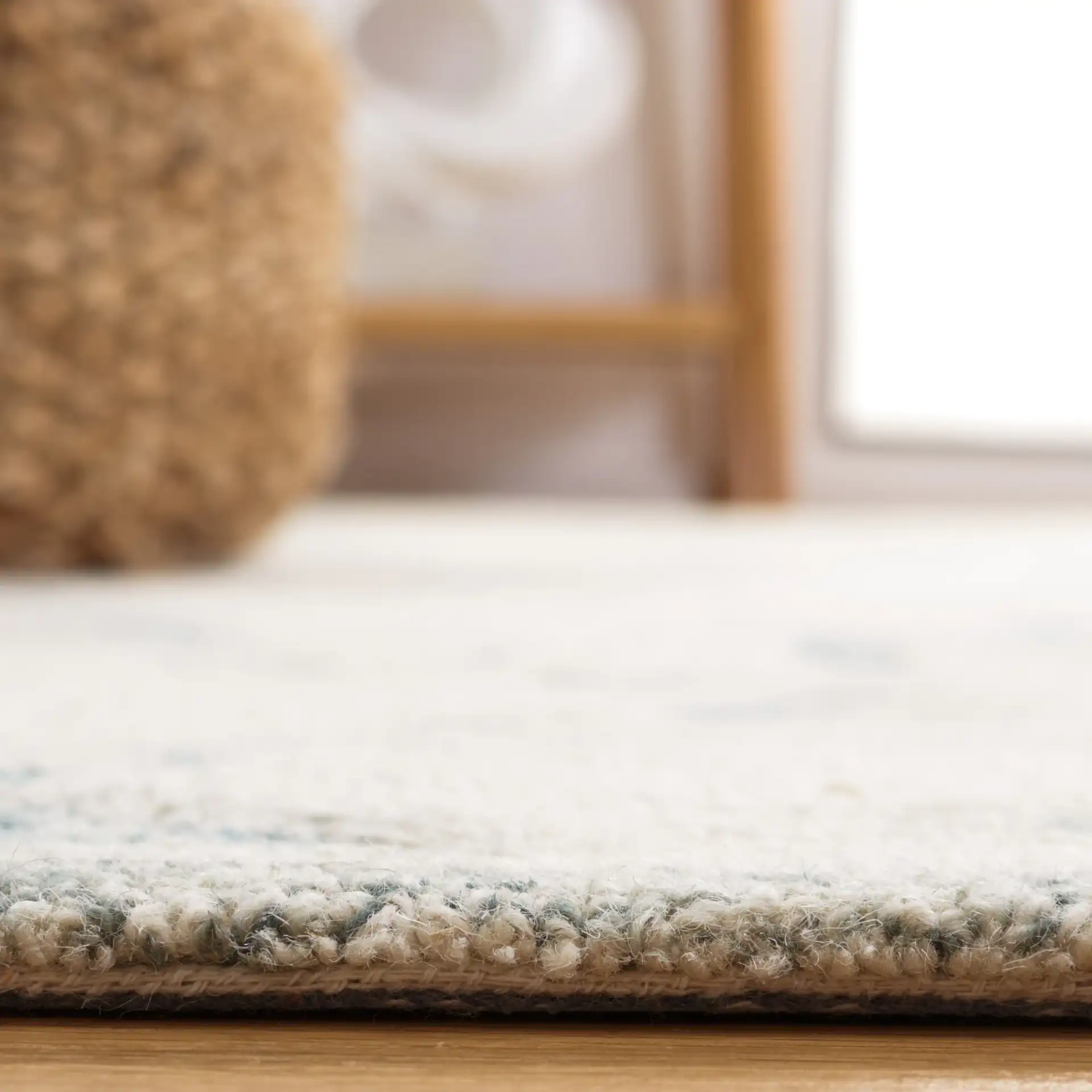 Micro-Loop Floral Hand-Tufted Wool Rug in Ivory / Blue in a styled room