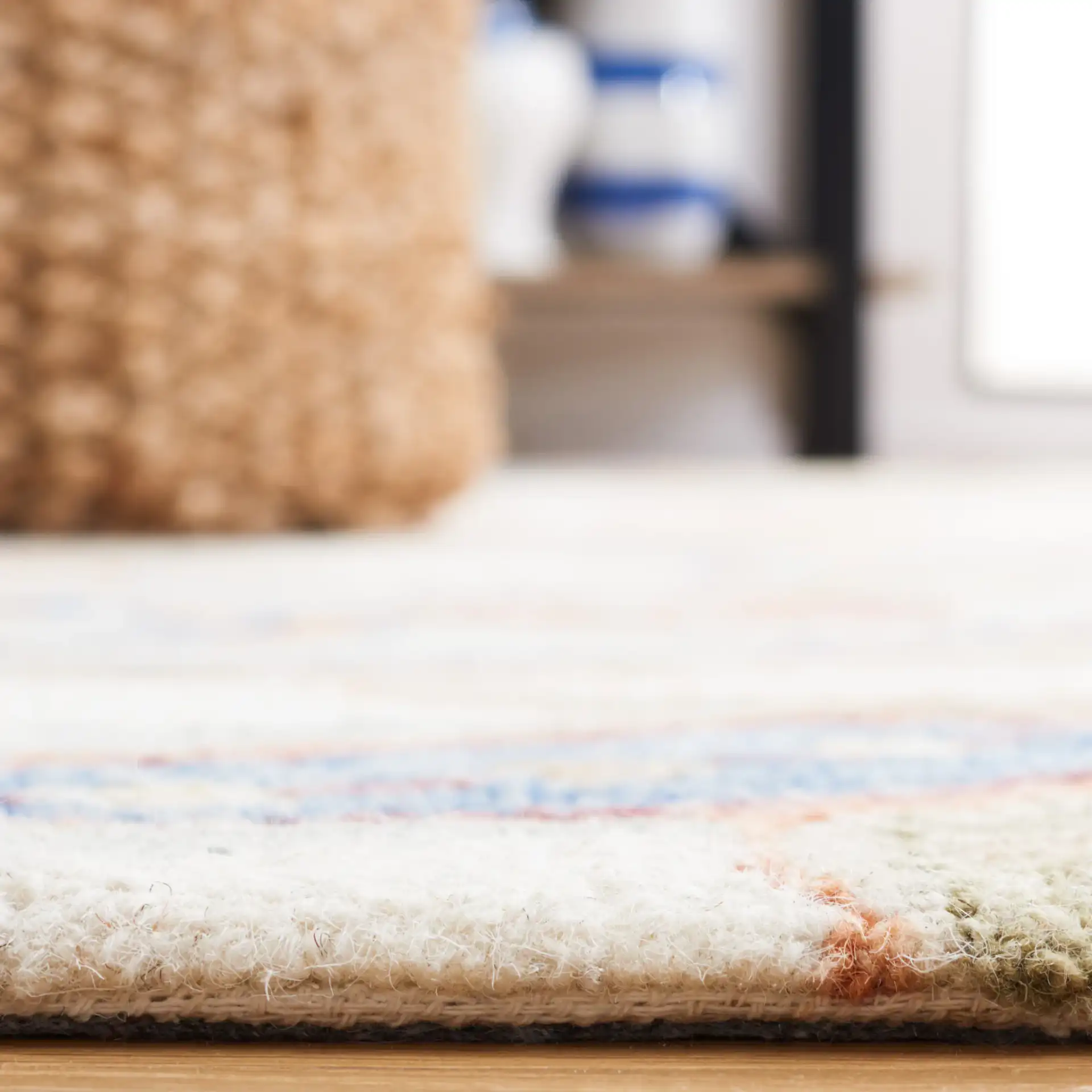 Micro-Loop Paisley Hand-Tufted Wool Rug in Ivory / Rust in a styled room