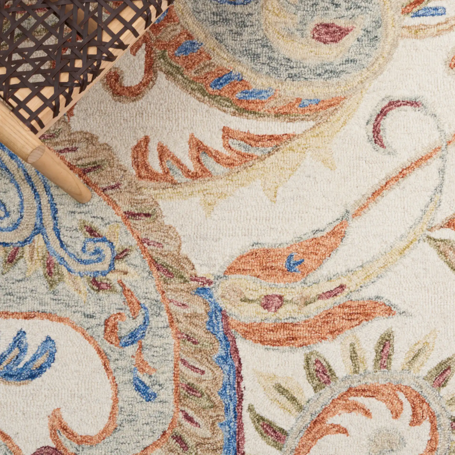 Micro-Loop Paisley Hand-Tufted Wool Rug in Ivory / Rust in a styled room