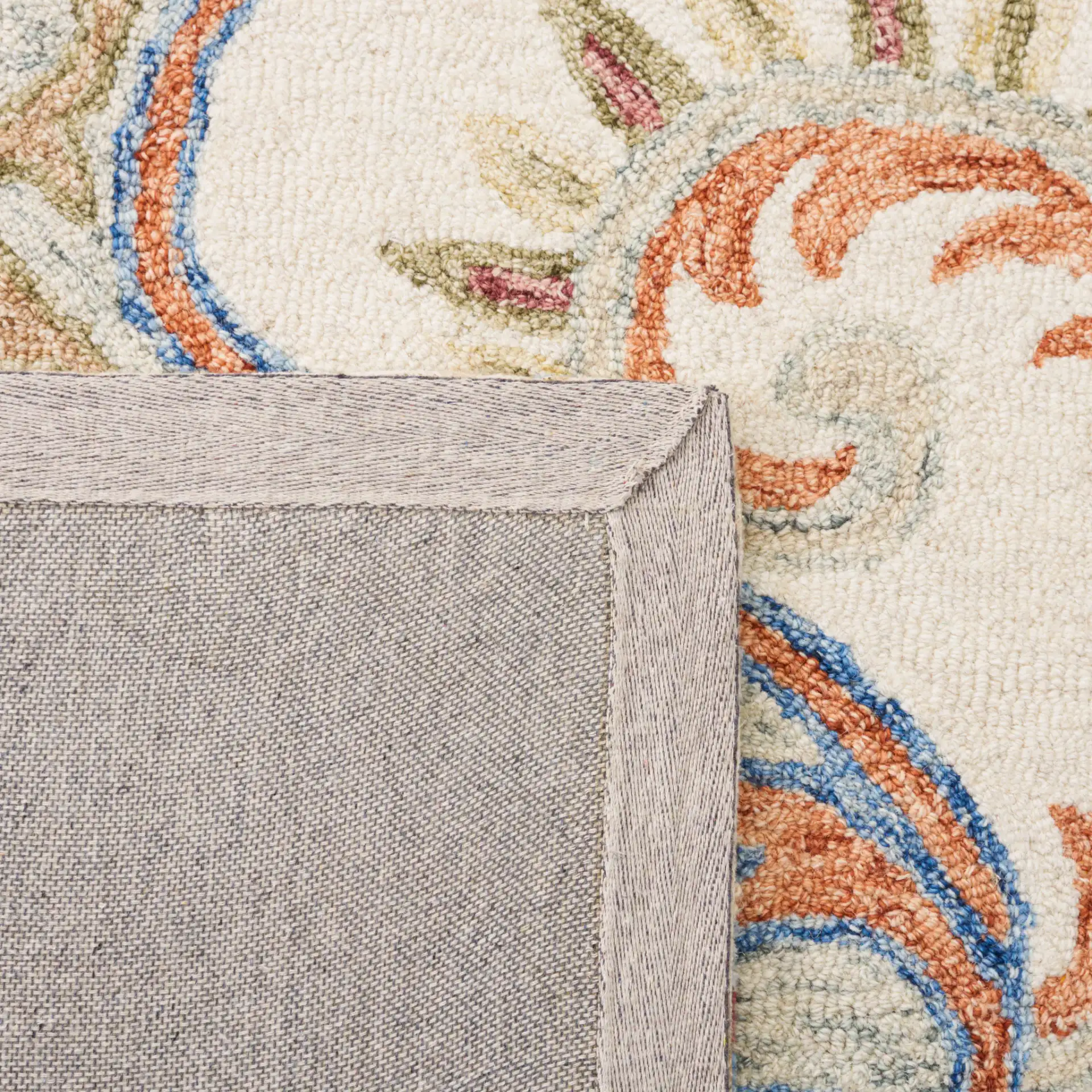 Micro-Loop Paisley Hand-Tufted Wool Rug in Ivory / Rust in a styled room