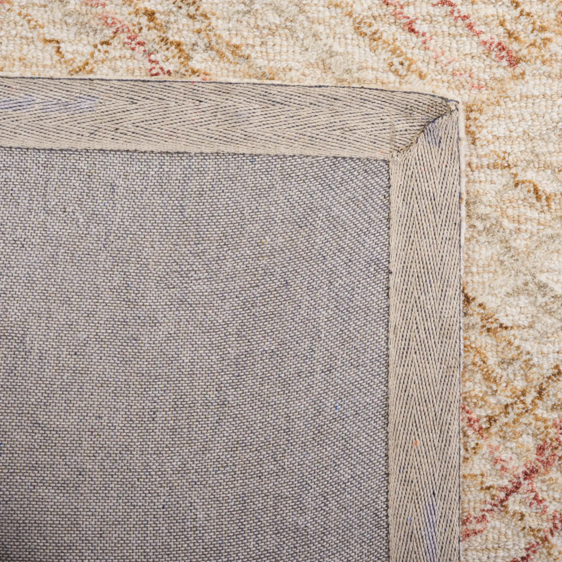 Micro-Loop Crosshatch Grid Hand-Tufted Wool Rug in Ivory / Red in a styled room