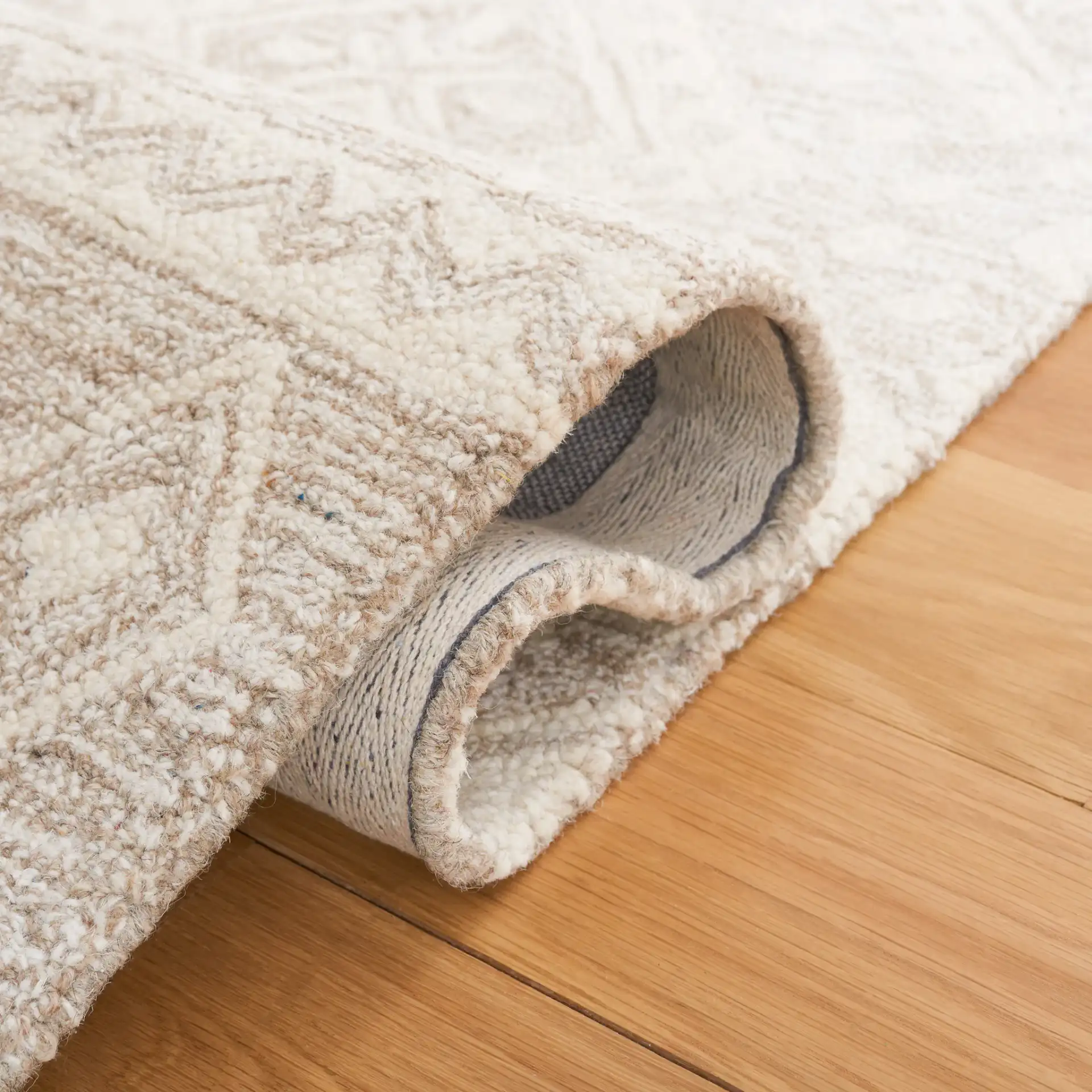 Micro-Loop Banded Geometric Hand-Tufted Wool Rug in Beige / Ivory in a styled room