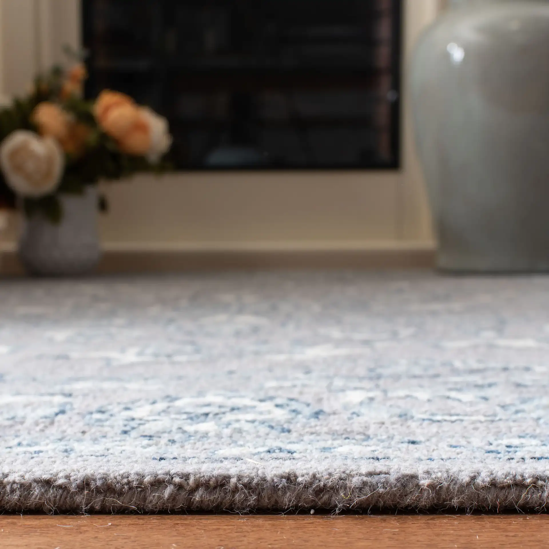Micro-Loop Micro Loop Floral Medallion Hand-Tufted Wool Rug in Light Gray / Ivory in a styled room
