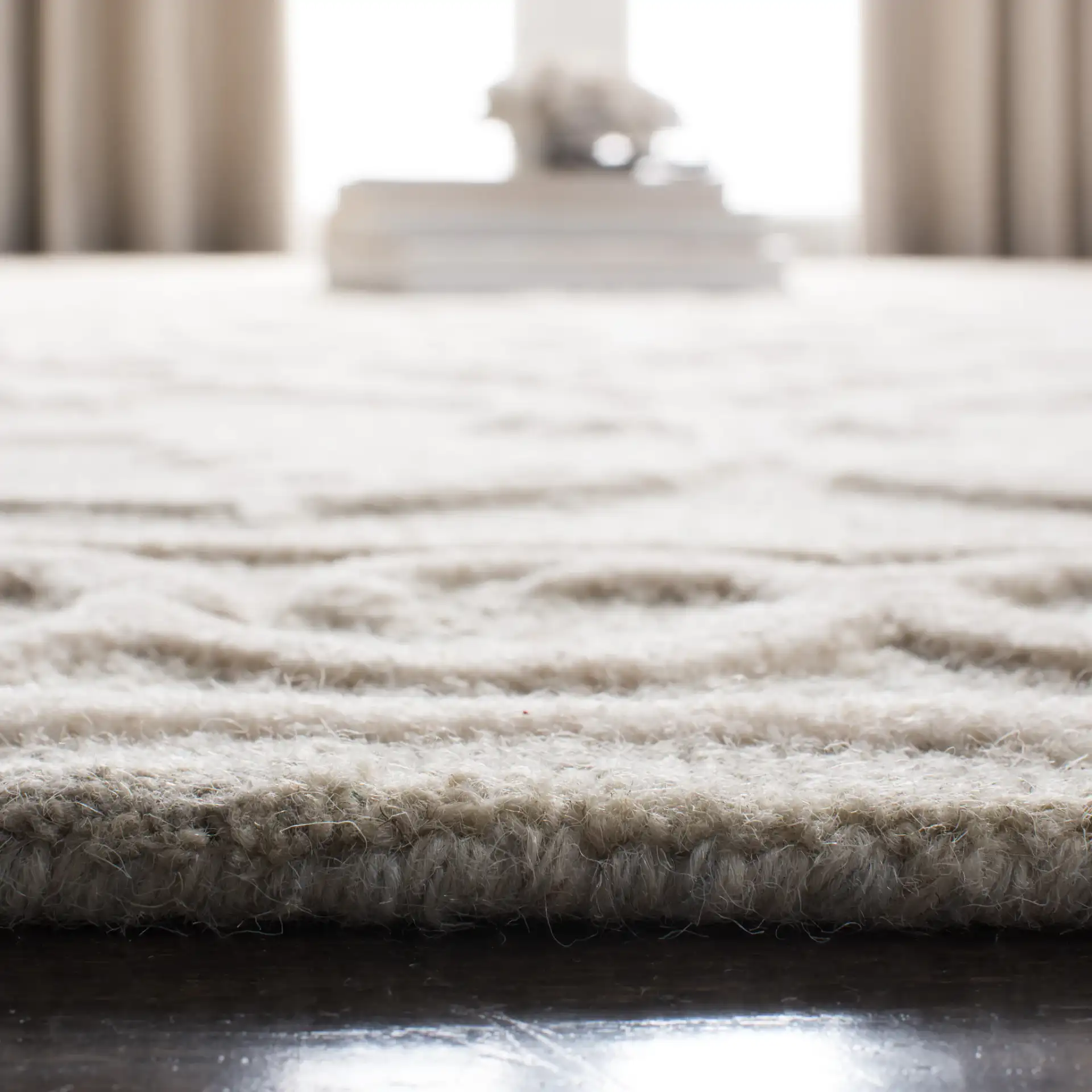 Micro-Loop Scrolling Vine Hand-Tufted Wool Rug in Light Gray / Ivory in a styled room