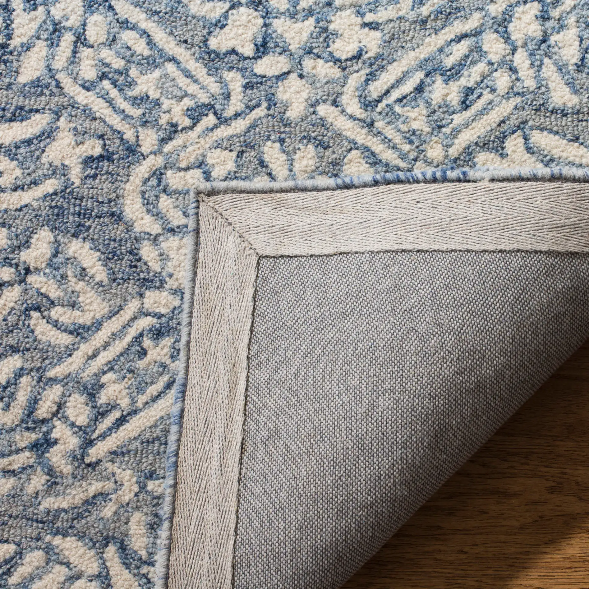Micro-Loop Damask Trellis Hand-Tufted Wool Rug in Blue / Ivory in a styled room