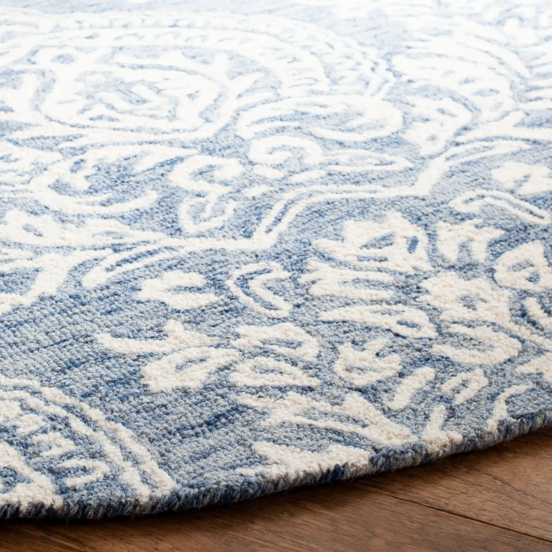Micro-Loop Paisley Damask Hand-Tufted Wool Rug in Blue / Ivory in a styled room