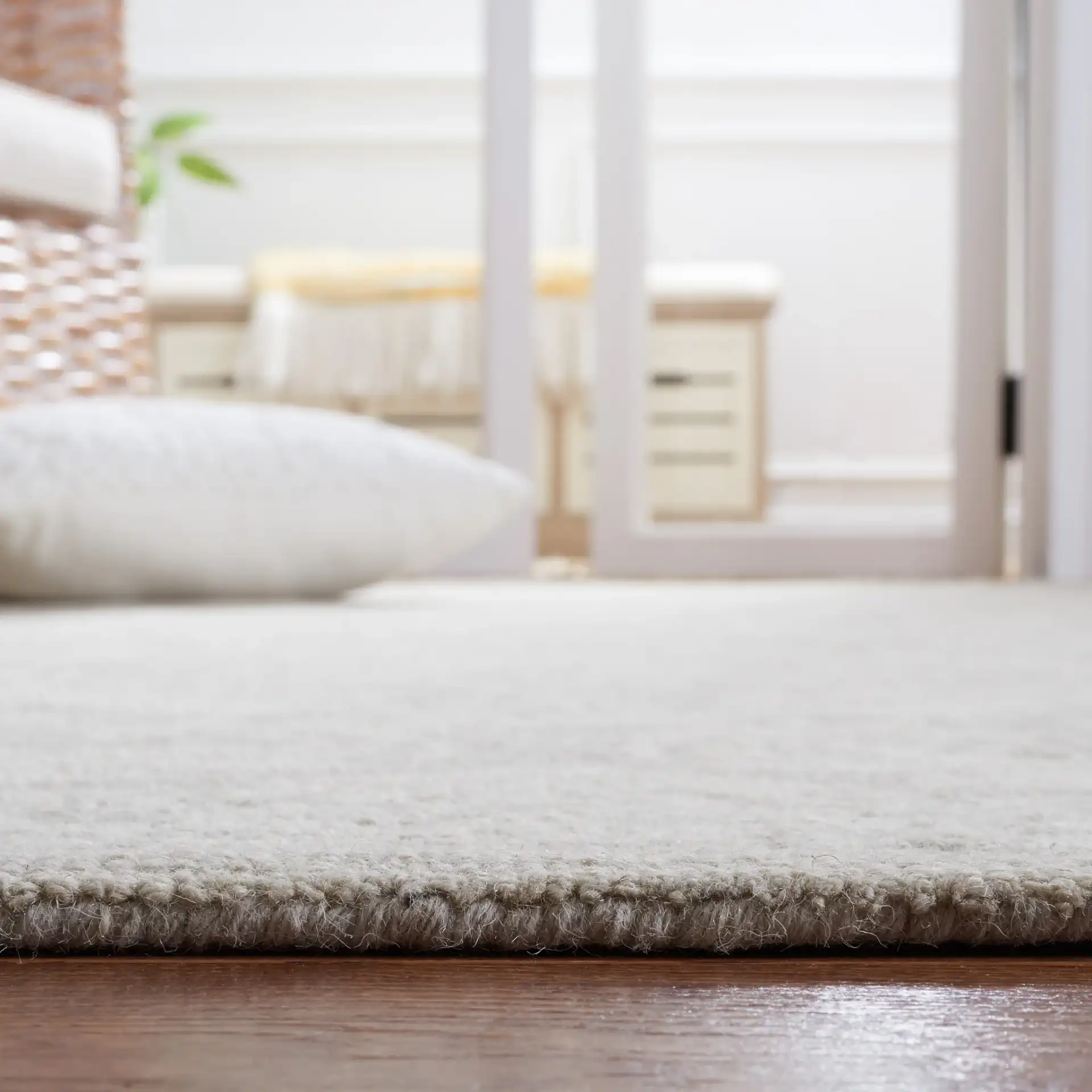 Micro-Loop Damask Floral Hand-Tufted Wool Rug in Silver in a styled room