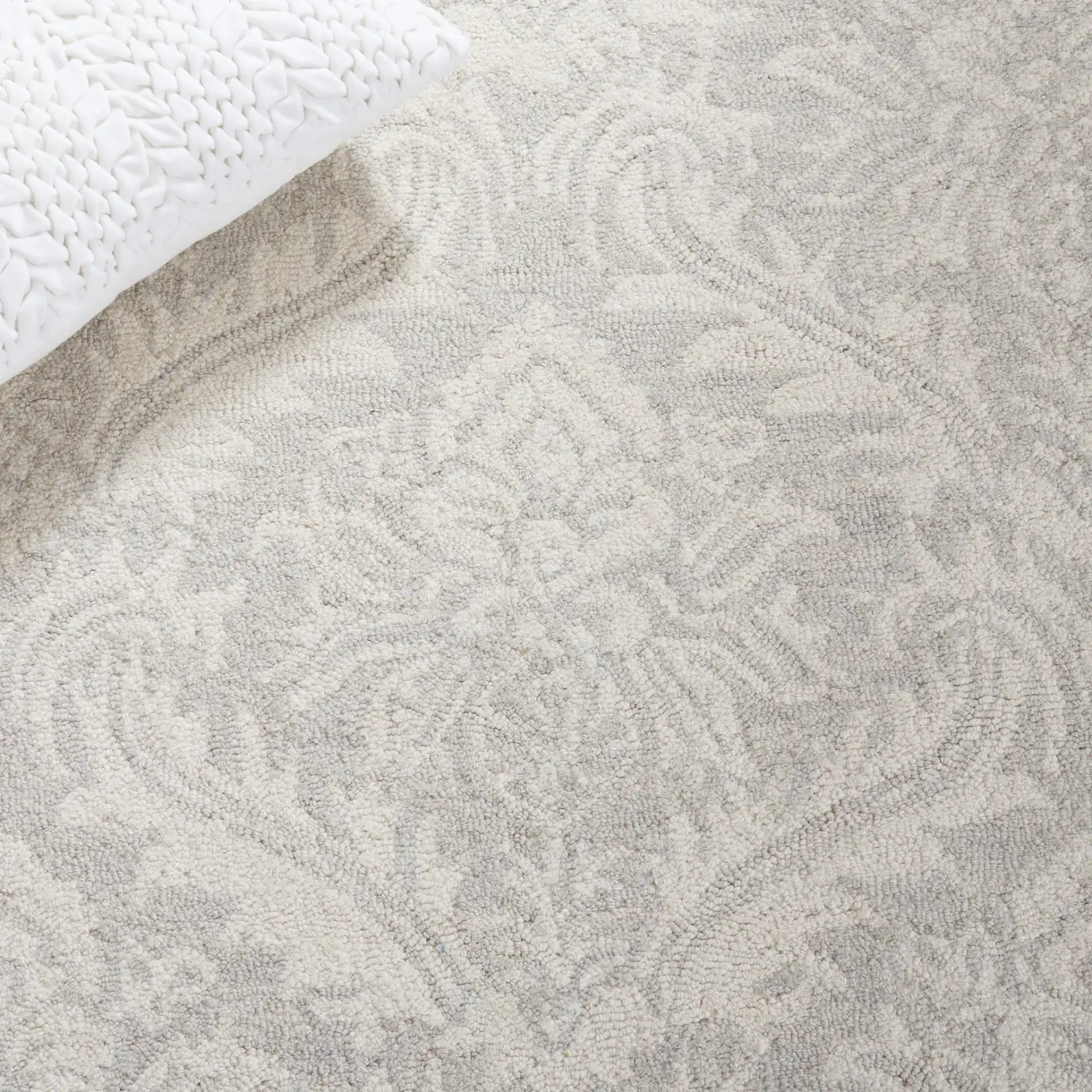 Micro-Loop Damask Floral Hand-Tufted Wool Rug in Silver in a styled room