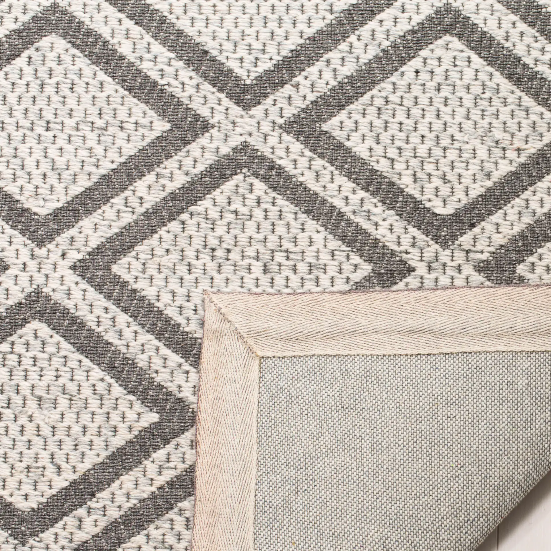 Micro-Loop Diamond Tile Hand-Tufted Wool Rug in Silver / Dark Gray in a styled room