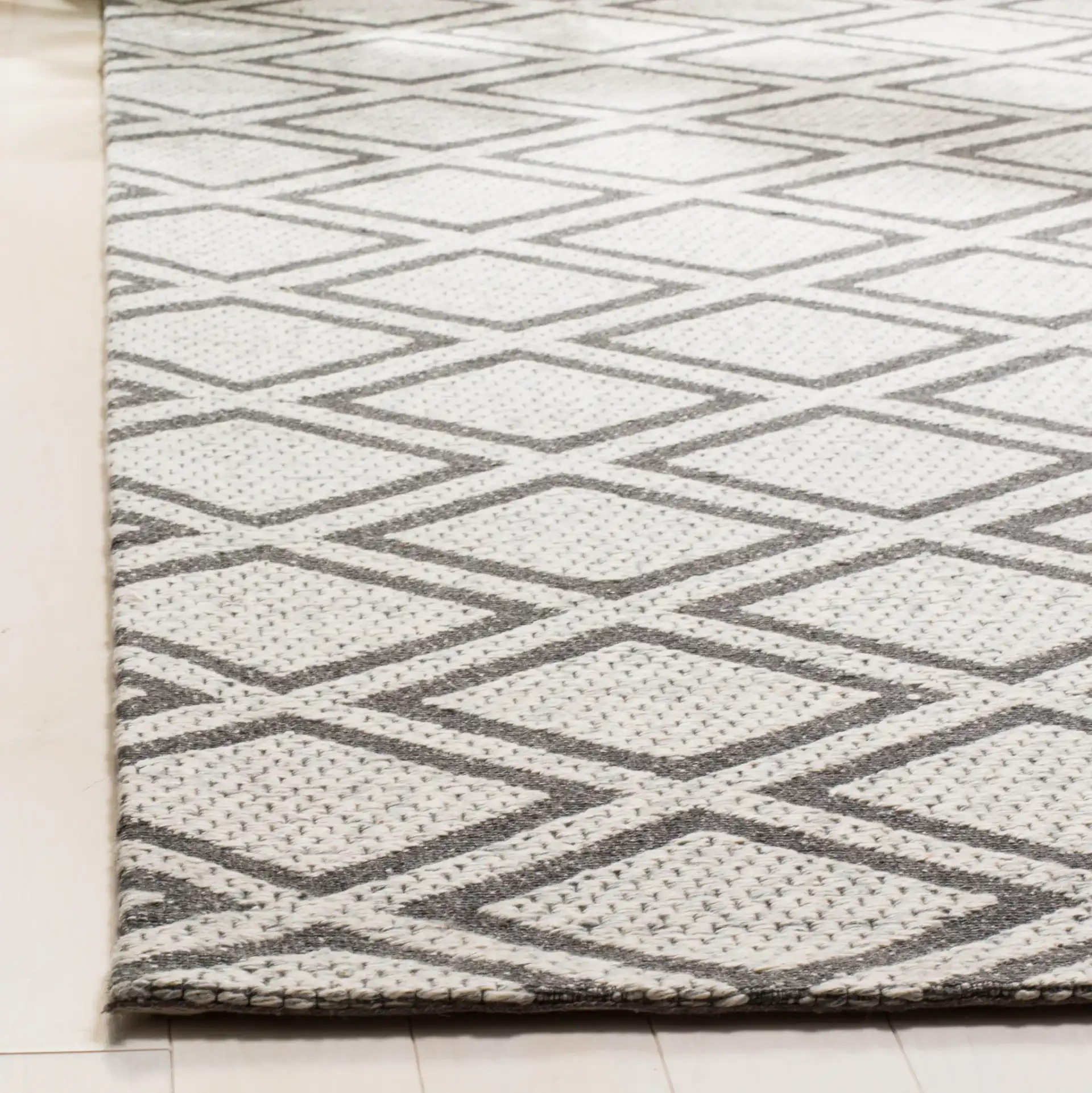 Micro-Loop Diamond Tile Hand-Tufted Wool Rug in Silver / Dark Gray in a styled room