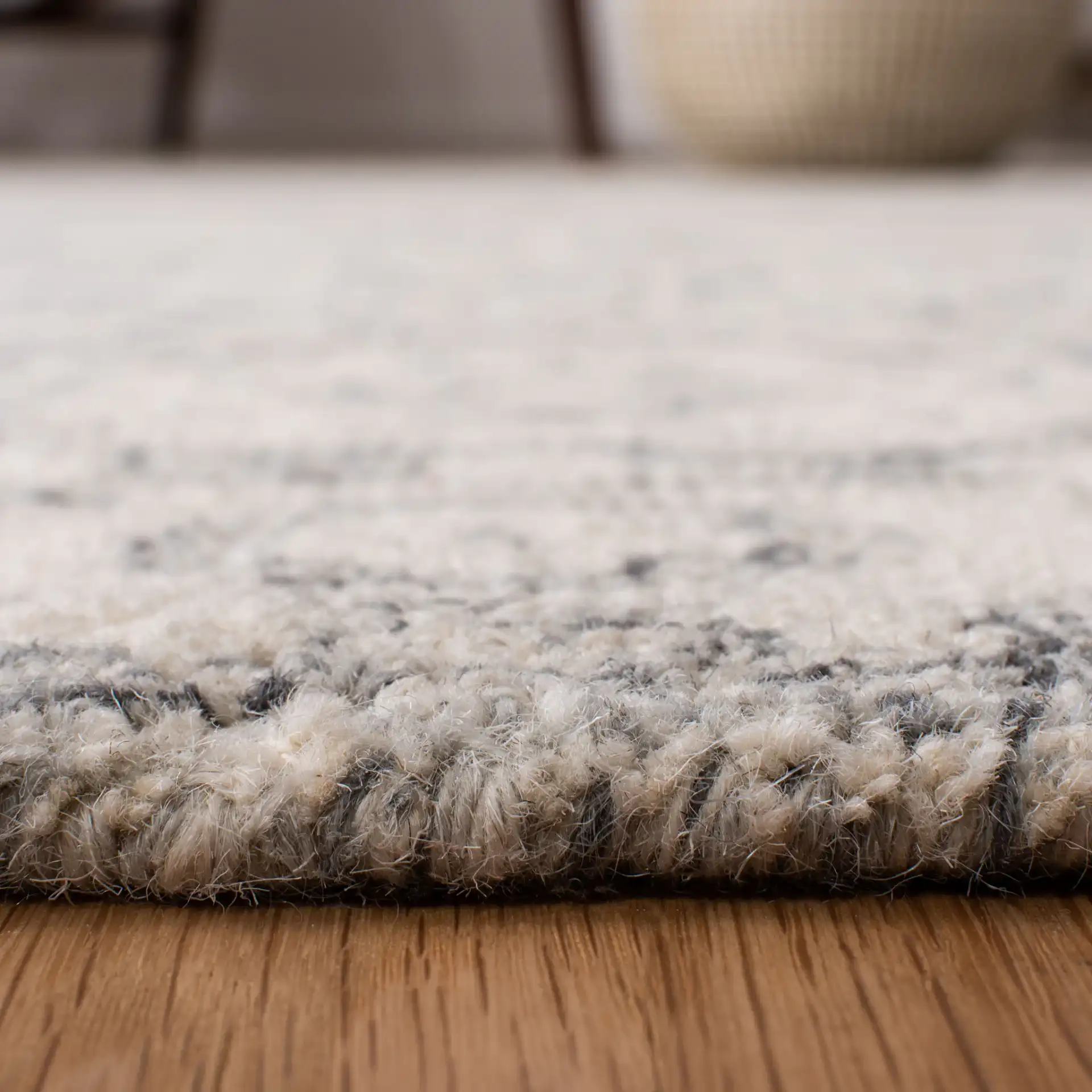 Micro-Loop Medallion Border Hand-Tufted Wool Rug in Charcoal / Ivory in a styled room
