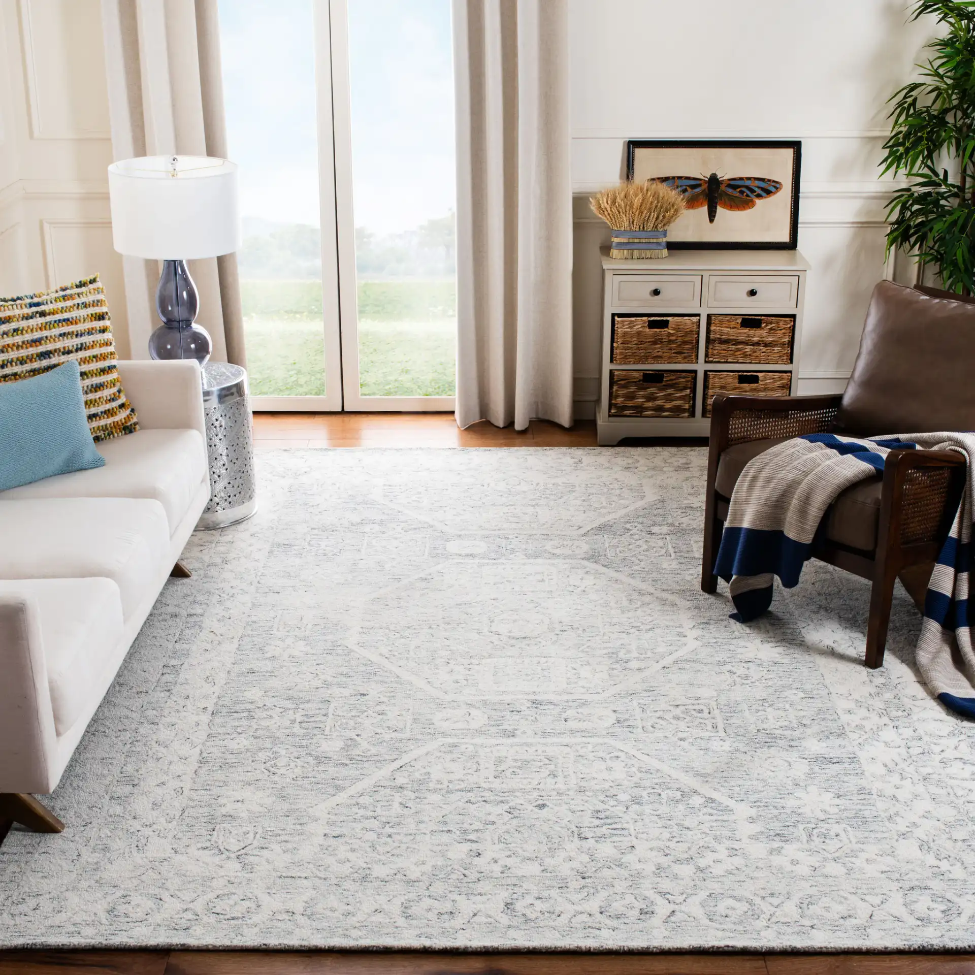 Micro-Loop Medallion Border Hand-Tufted Wool Rug in Charcoal / Ivory in a styled room