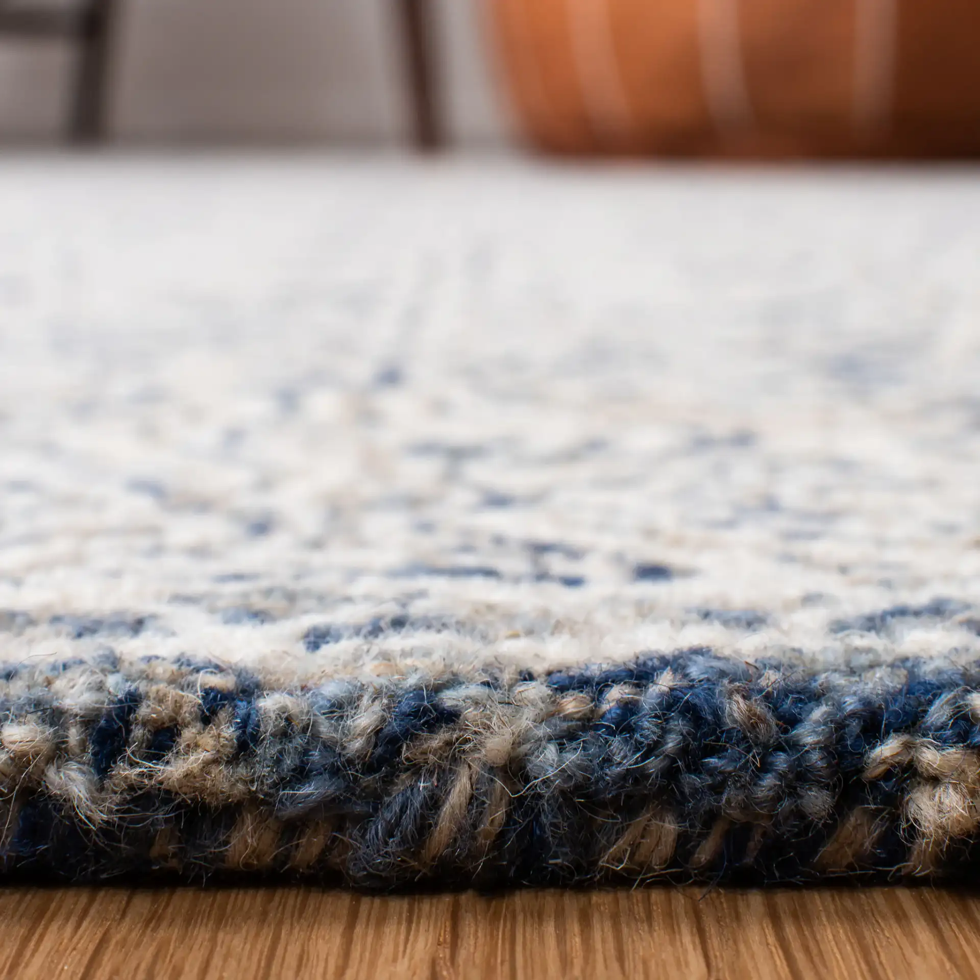 Micro-Loop Diamond Hand-Tufted Wool Rug in Navy / Ivory in a styled room