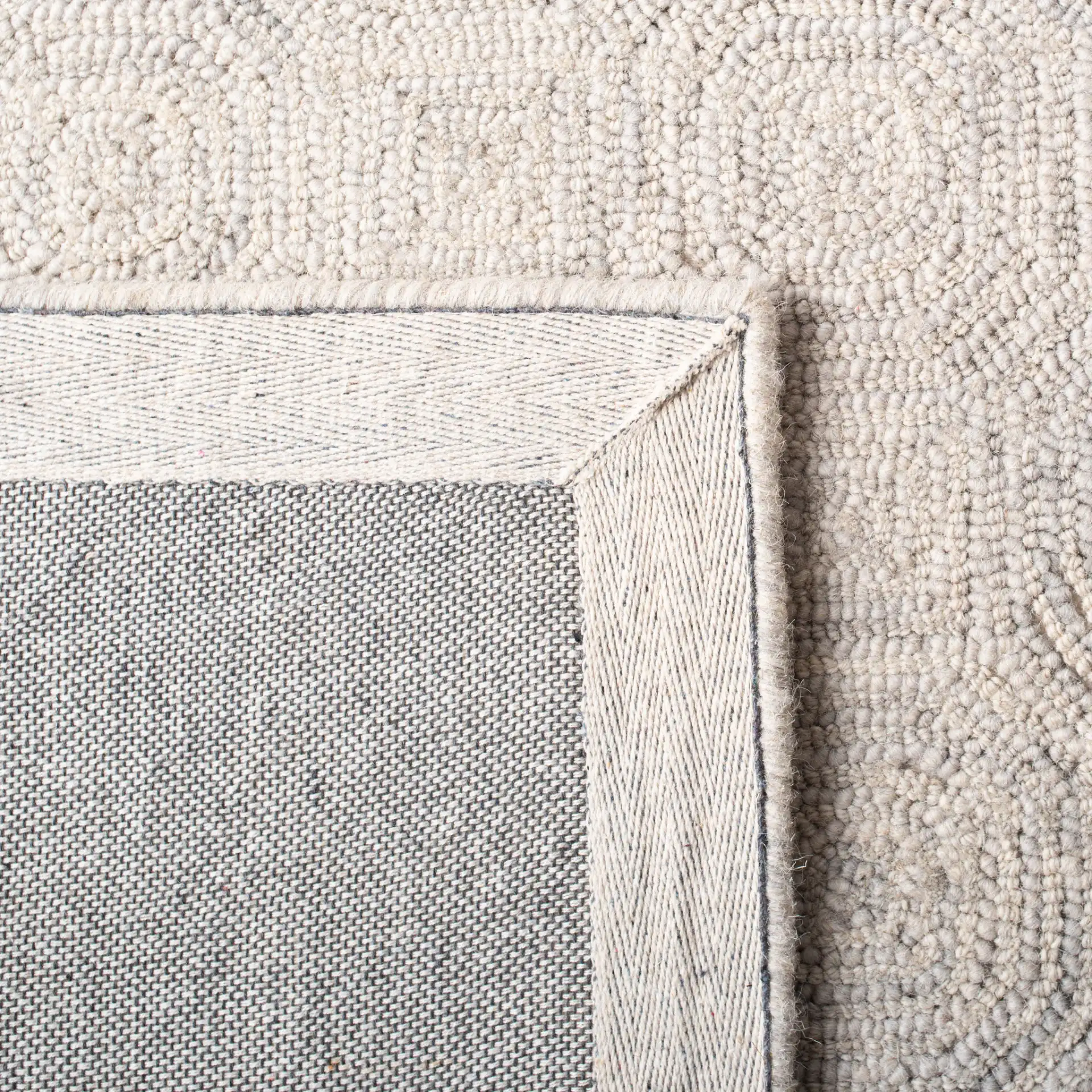 Micro-Loop Concentric Square Hand-Tufted Wool Rug in Silver / Gray in a styled room