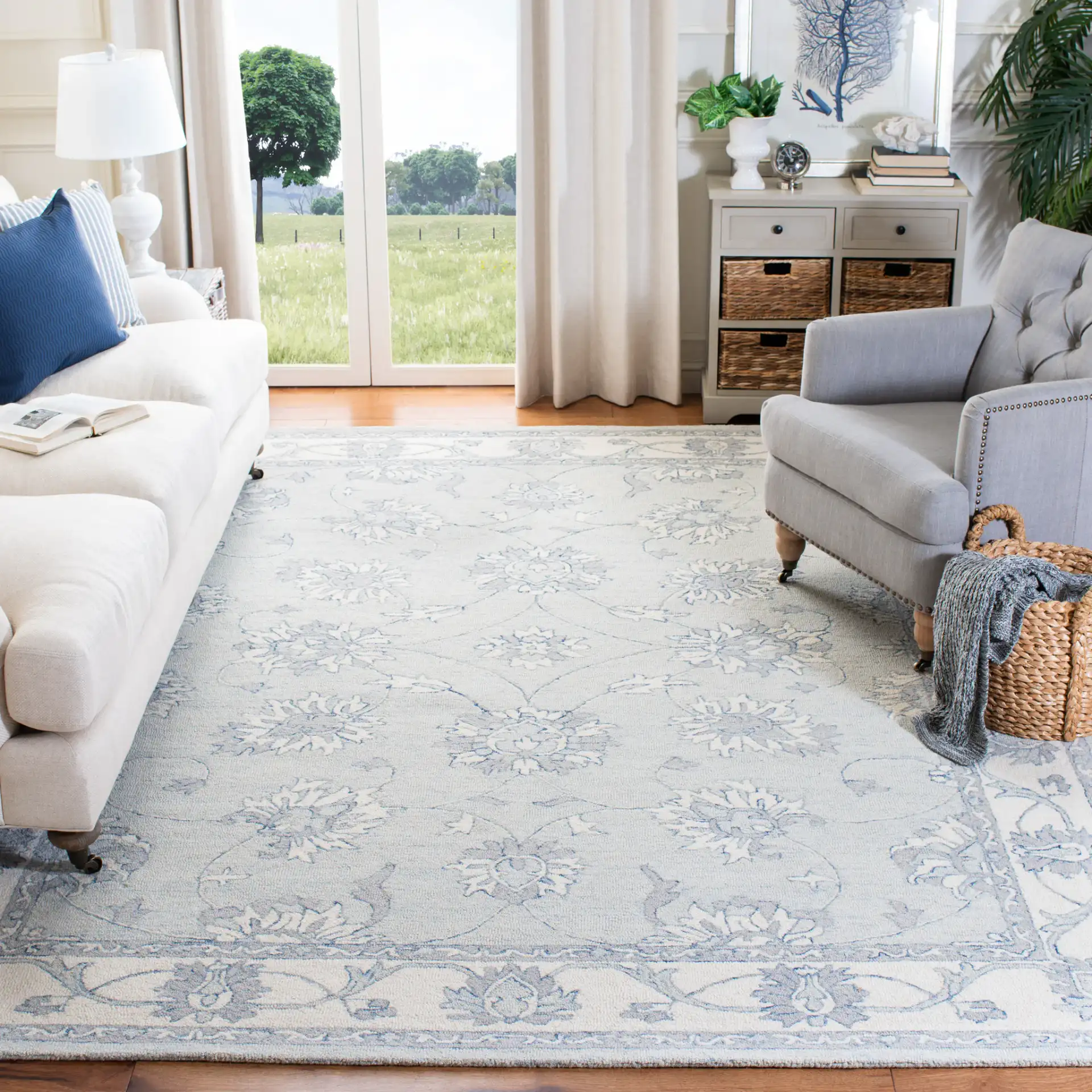 Micro-Loop Floral Border Hand-Tufted Wool Rug in Light Blue / Ivory in a styled room
