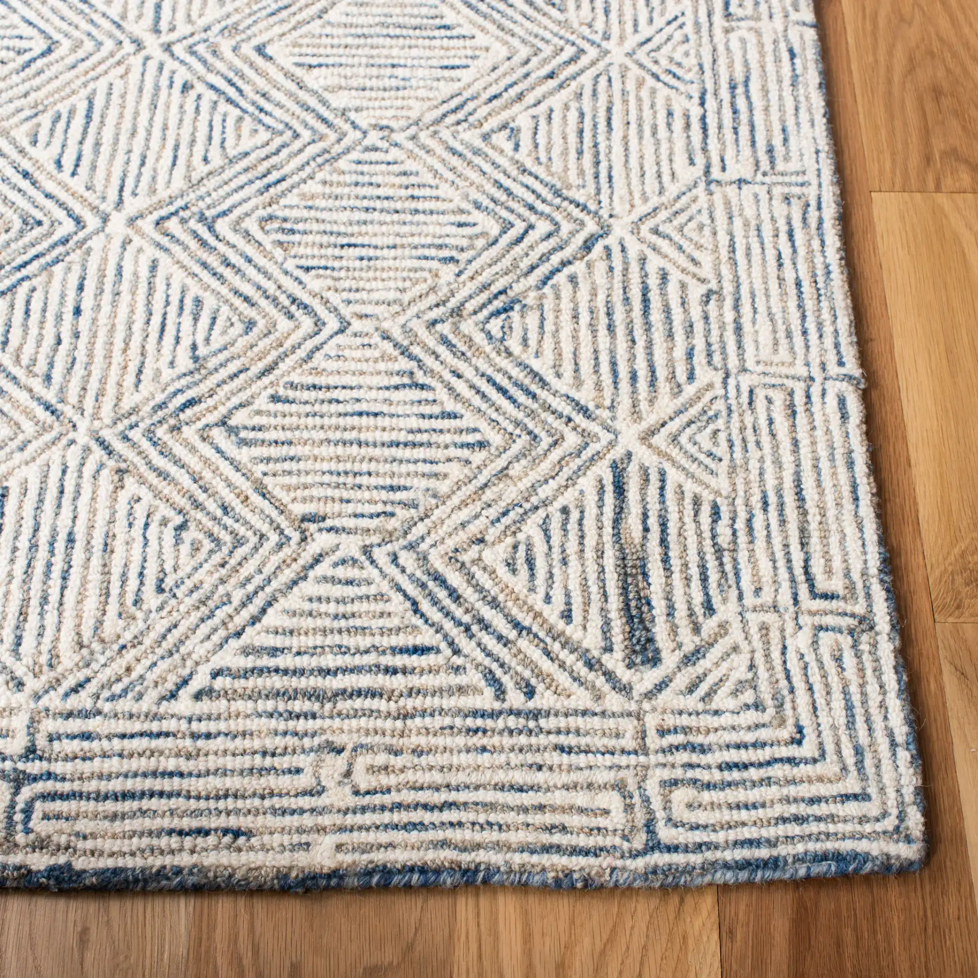 Micro-Loop Diamond Maze Hand-Tufted Wool Rug in Blue / Ivory in a styled room