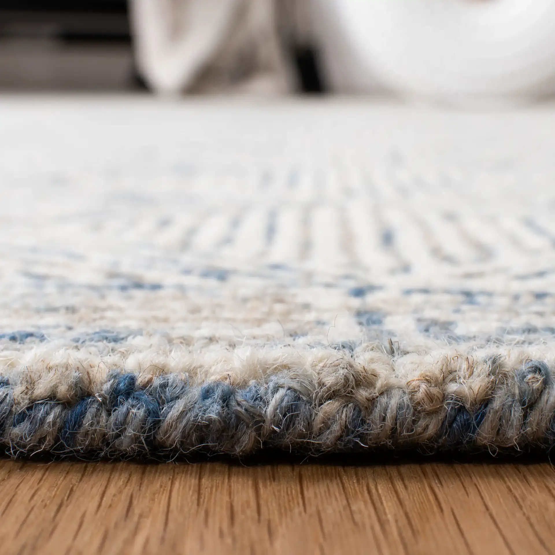 Micro-Loop Diamond Maze Hand-Tufted Wool Rug in Blue / Ivory in a styled room