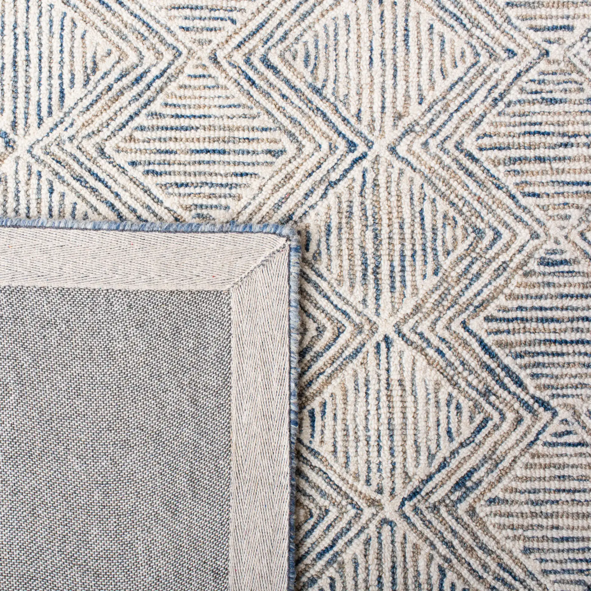 Micro-Loop Diamond Maze Hand-Tufted Wool Rug in Blue / Ivory in a styled room