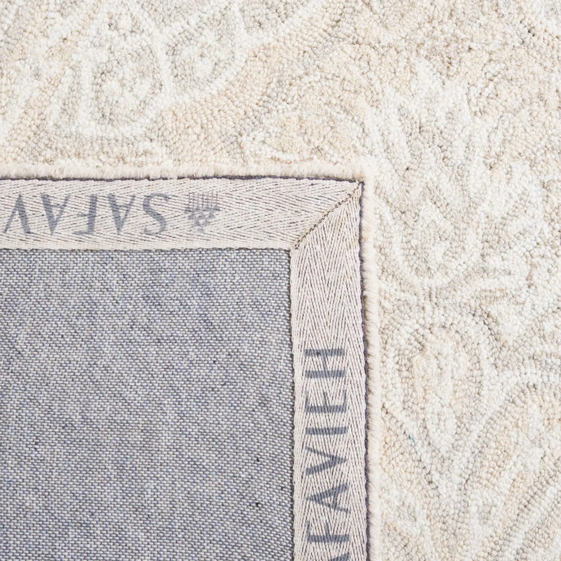 Micro-Loop Damask Palmette Hand-Tufted Wool Rug in Beige in a styled room