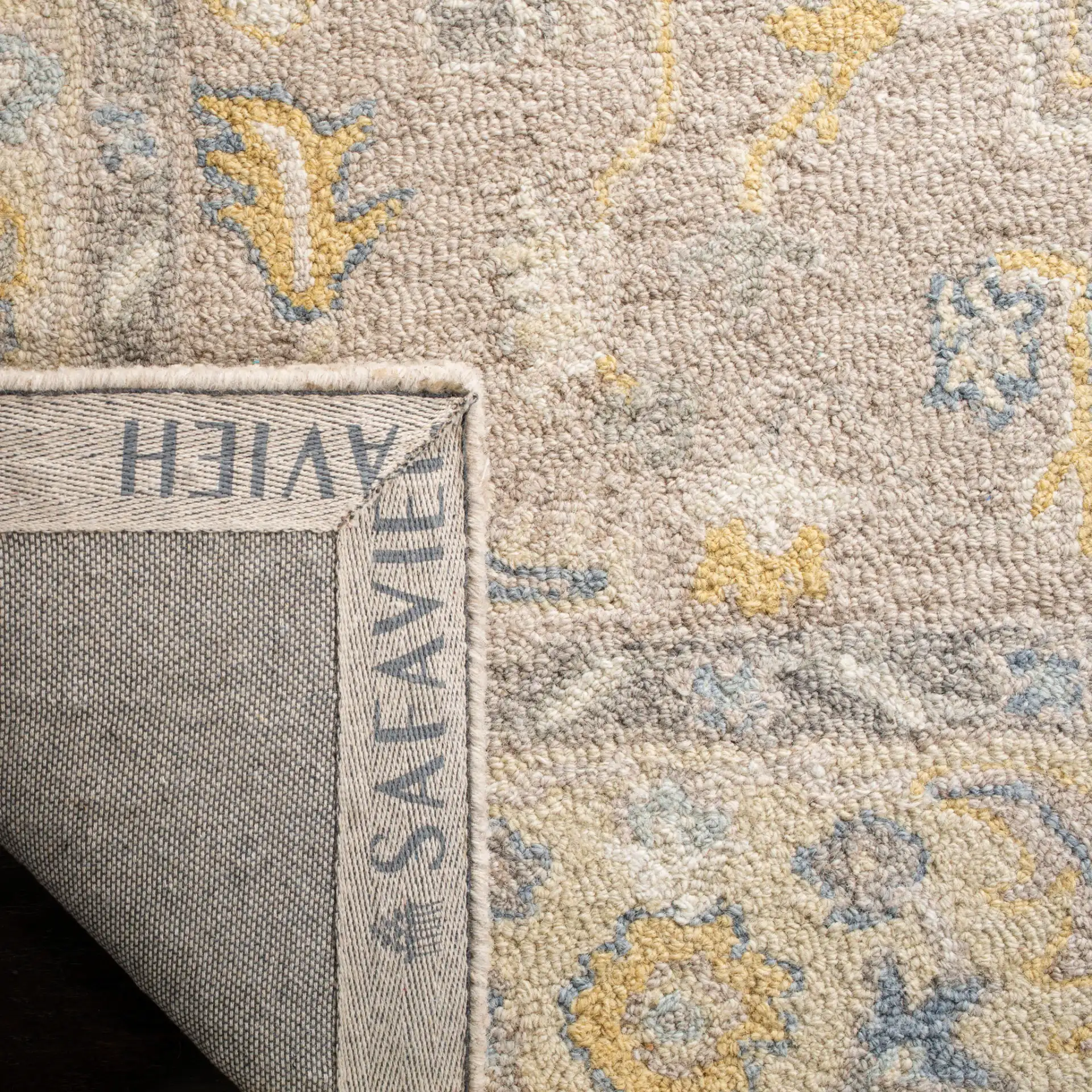 Micro-Loop Stepped Medallion Hand-Tufted Wool Rug in Beige / Gray in a styled room