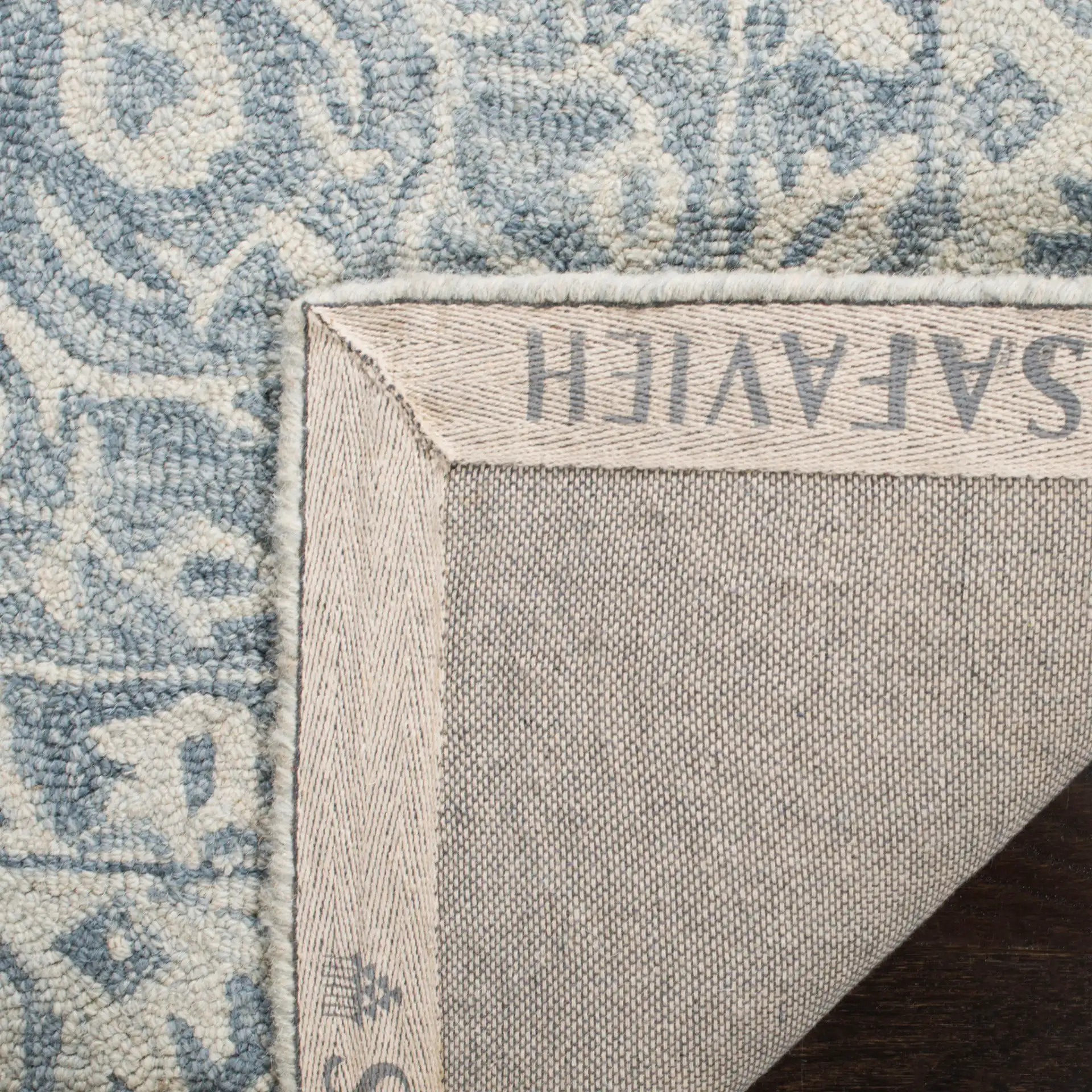 Micro-Loop Traditional Medallion Hand-Tufted Wool Rug in Blue / Light Blue in a styled room