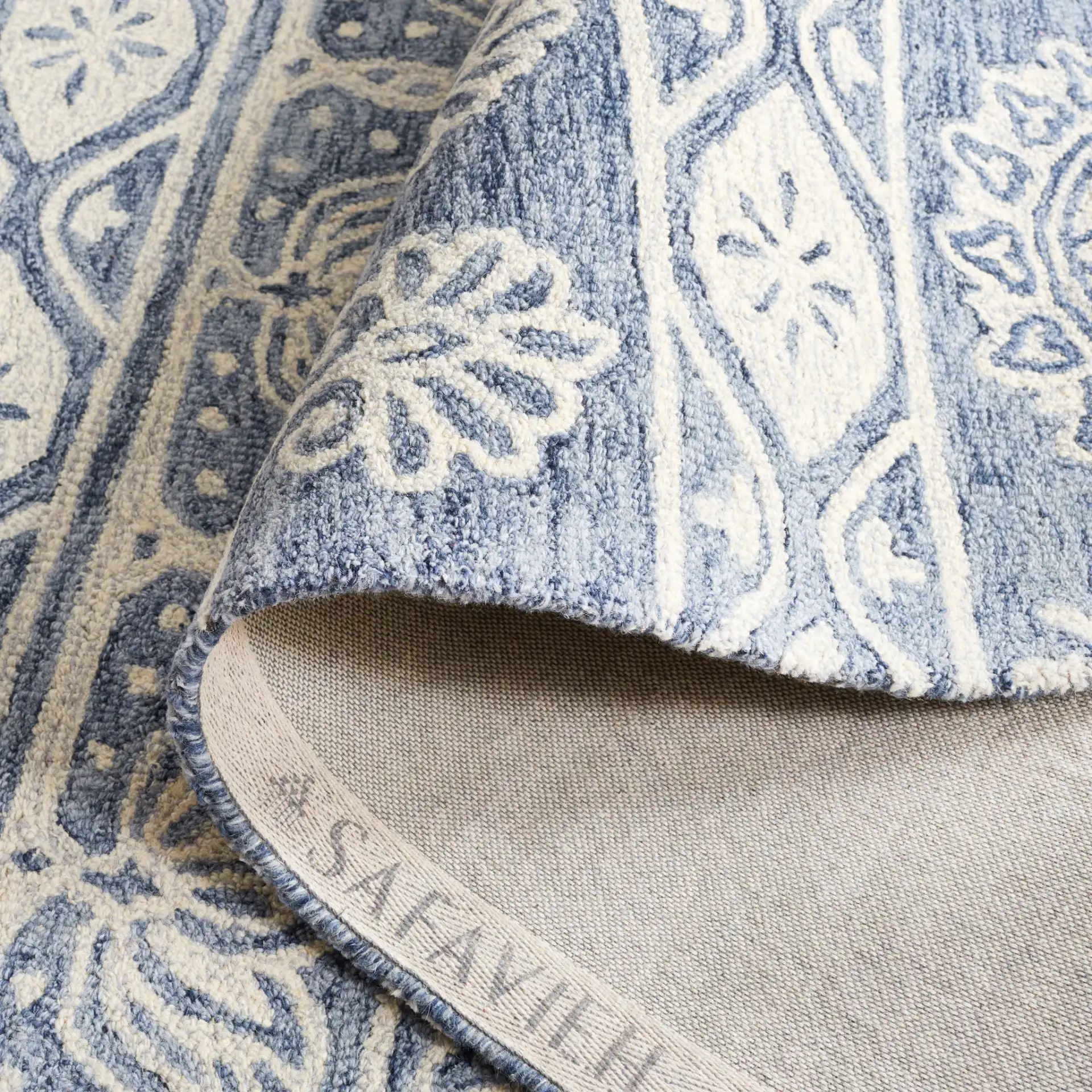Micro-Loop Banded Medallion Hand-Tufted Wool Rug in Blue / Ivory in a styled room