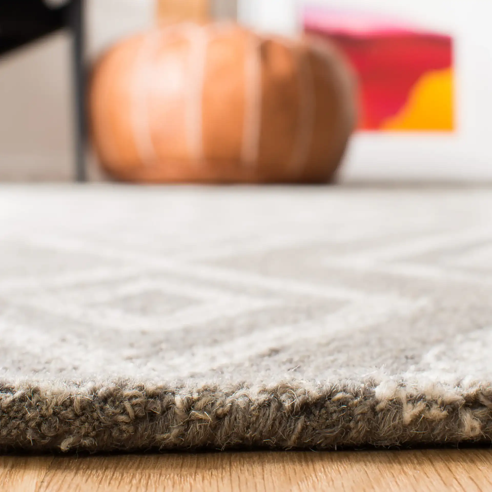 Micro-Loop Nested Diamond Hand-Tufted Wool Rug in Gray / Ivory in a styled room
